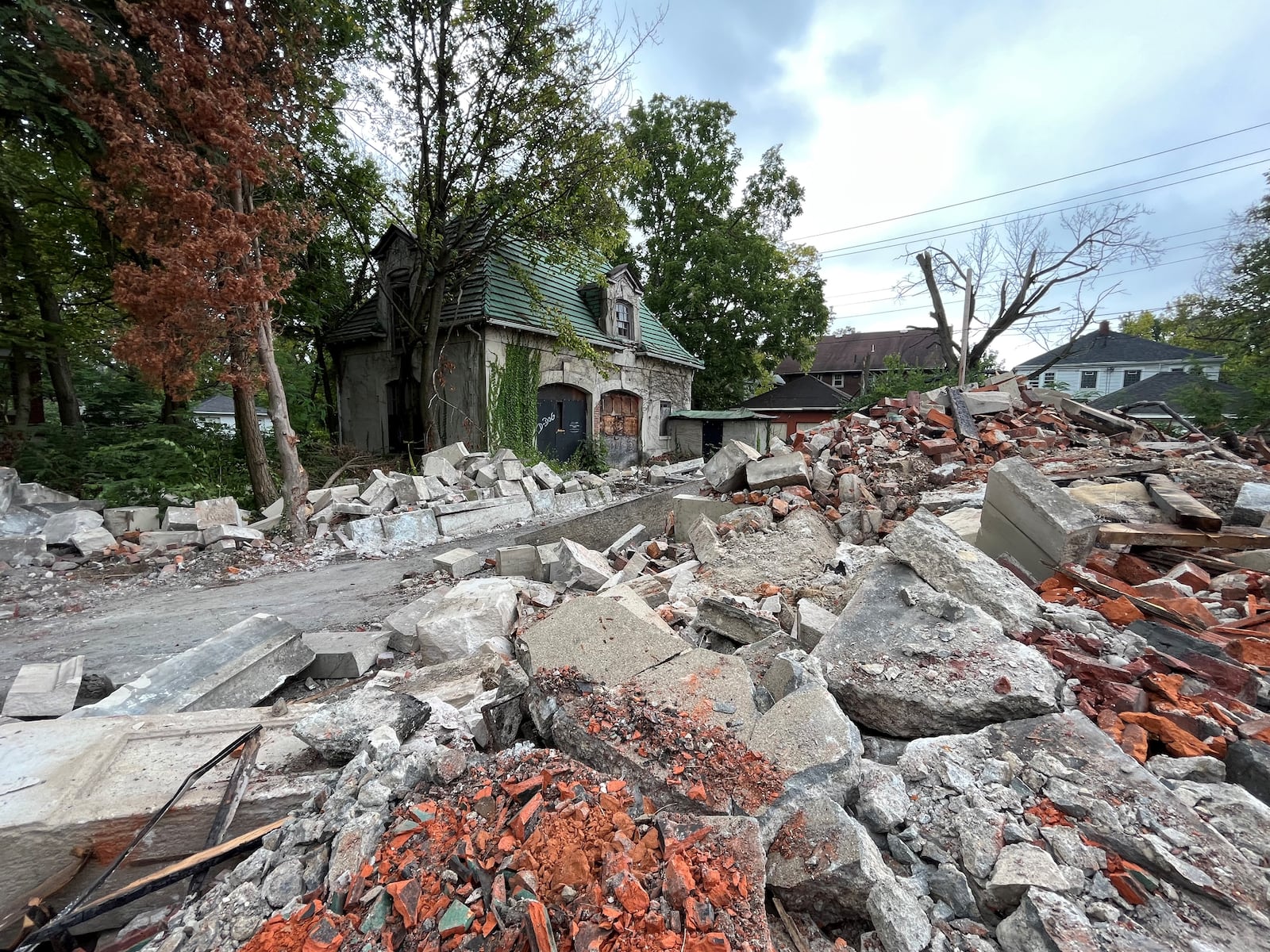 A mound of rubble and debris at what was the Traxler Mansion on Yale Avenue in northwest Dayton. CORNELIUS FROLIK / STAFF