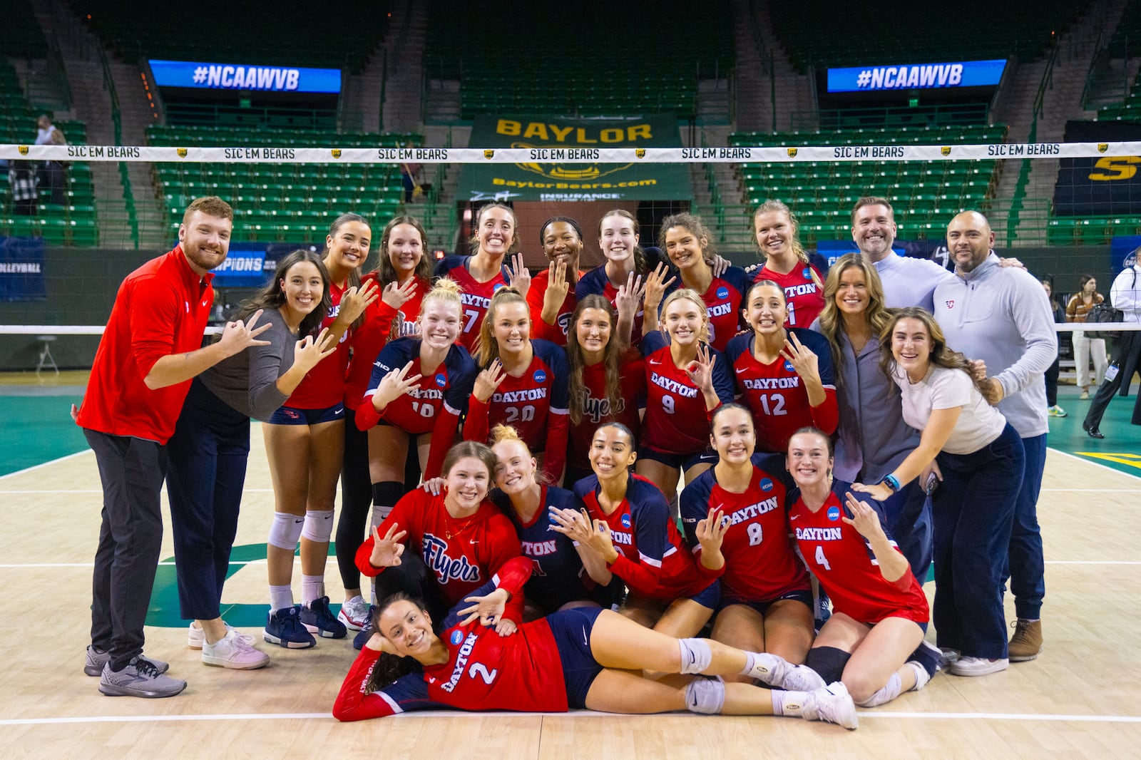 The Dayton volleyball team poses for a photo after beating Baylor in the second round of the NCAA tournament on Friday, Dec. 6, 2024, in Waco, Texas. Photo courtesy of UD