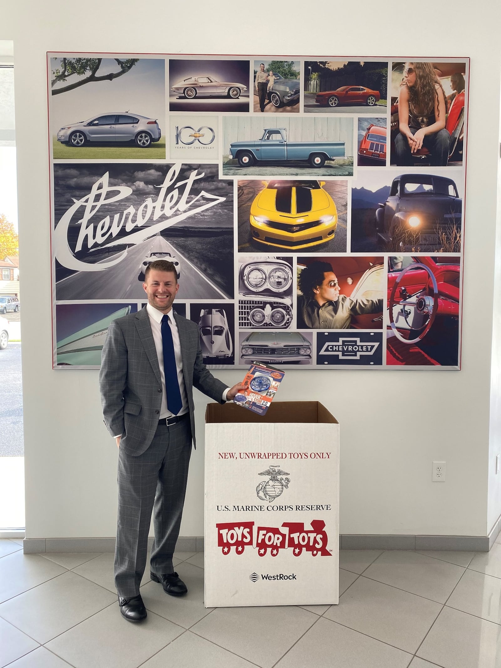 Jeff Schmitt Auto Group has been collecting for Toys for Tots since 2001. Jay Schmitt stands next to a collection box. CONTRIBUTED