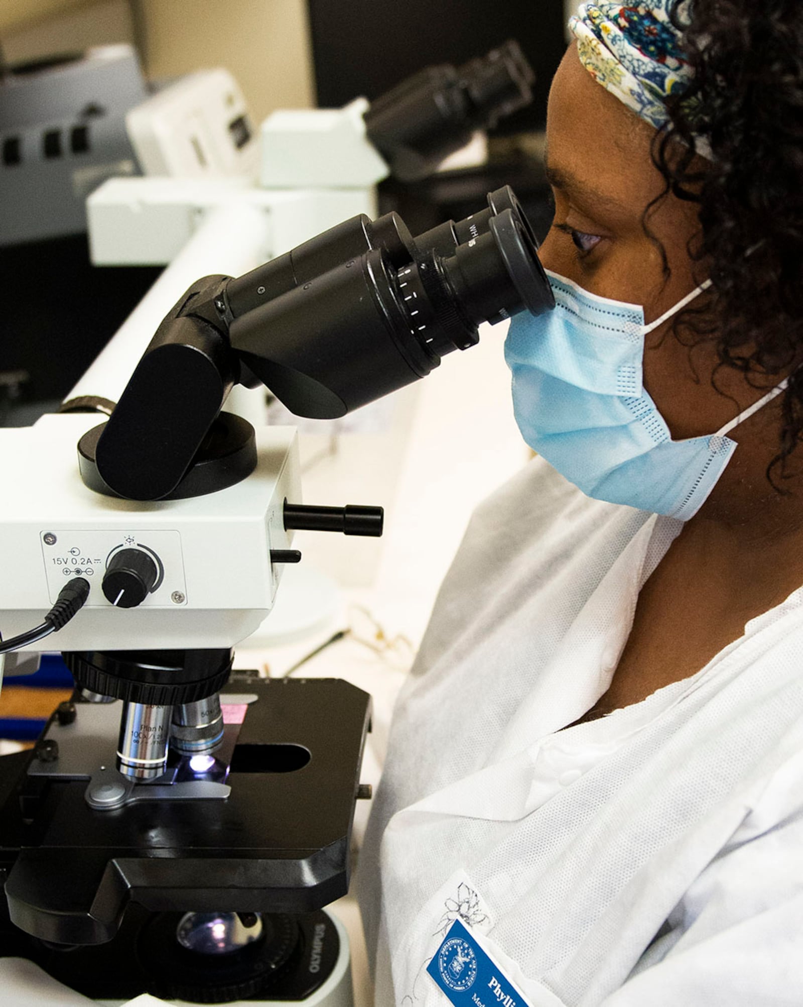 Phyllis Trigg, a medical laboratory technician with the 88th Medical Group, examines a slide under a microscope inside the Wright-Patterson Medical Center April 28. U.S. AIR FORCE PHOTO/WESLEY FARNSWORTH