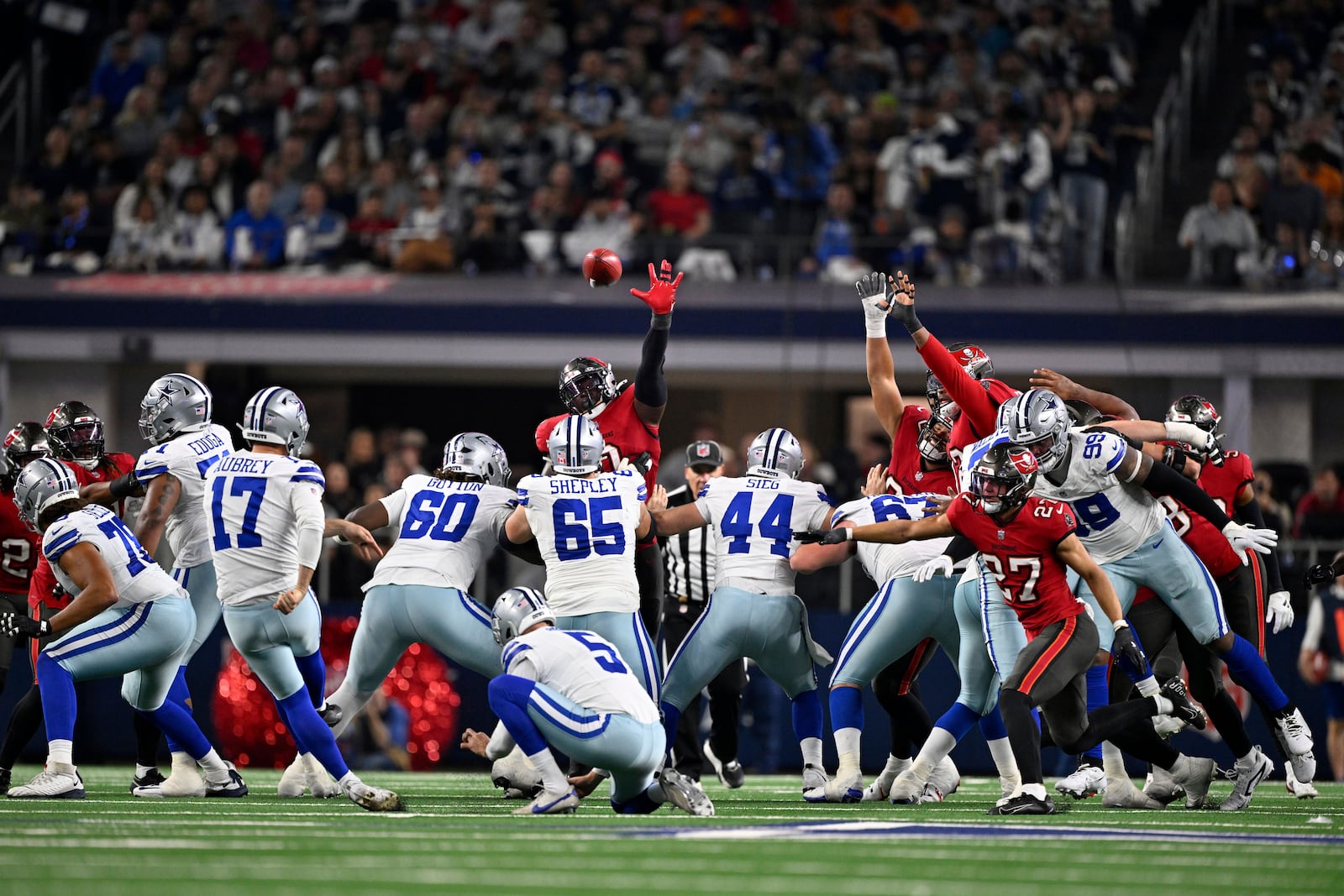 Dallas Cowboys place kicker Brandon Aubrey (17) kicks a 53-yard field goal in the second half of an NFL football game against the Tampa Bay Buccaneers in Arlington, Texas, Sunday, Dec. 22, 2024. (AP Photo/Jerome Miron)