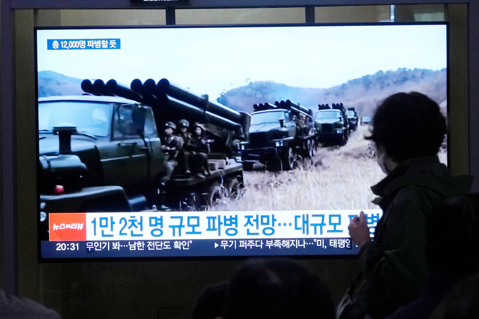 A TV screen shows file images of North Korean soldiers during a news program at Seoul Railway Station in Seoul, South Korea, Friday, Oct. 18, 2024. (AP Photo/Ahn Young-joon)