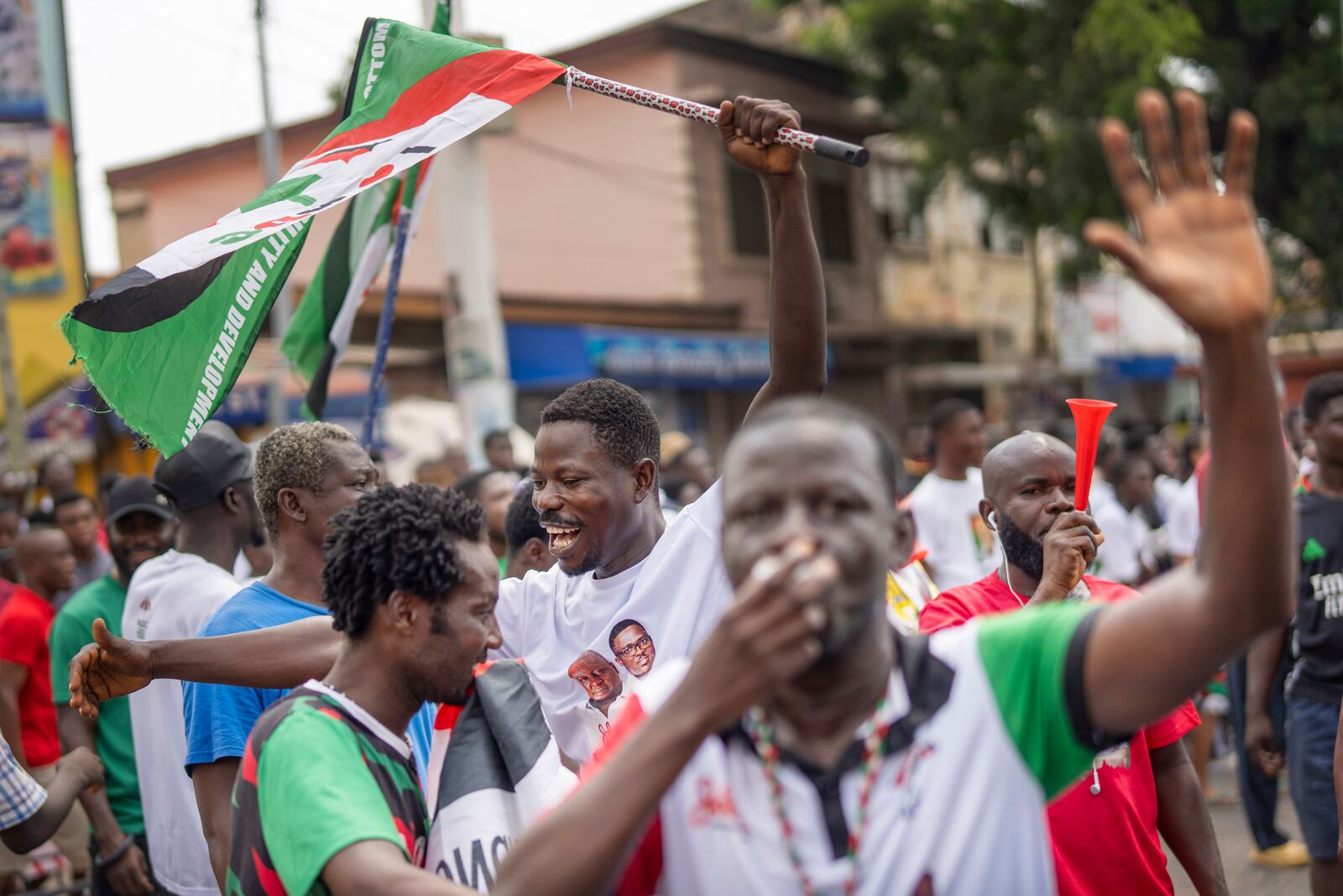 Supporters of opposition candidate and former President John Dramani Mahama celebrate his victory after his opponent Ghana’s vice president and ruling party candidate, Mahamudu Bawumia conceded in Accra, Ghana, Sunday, December 8, 2024. (AP Photo/Jerome Delay)