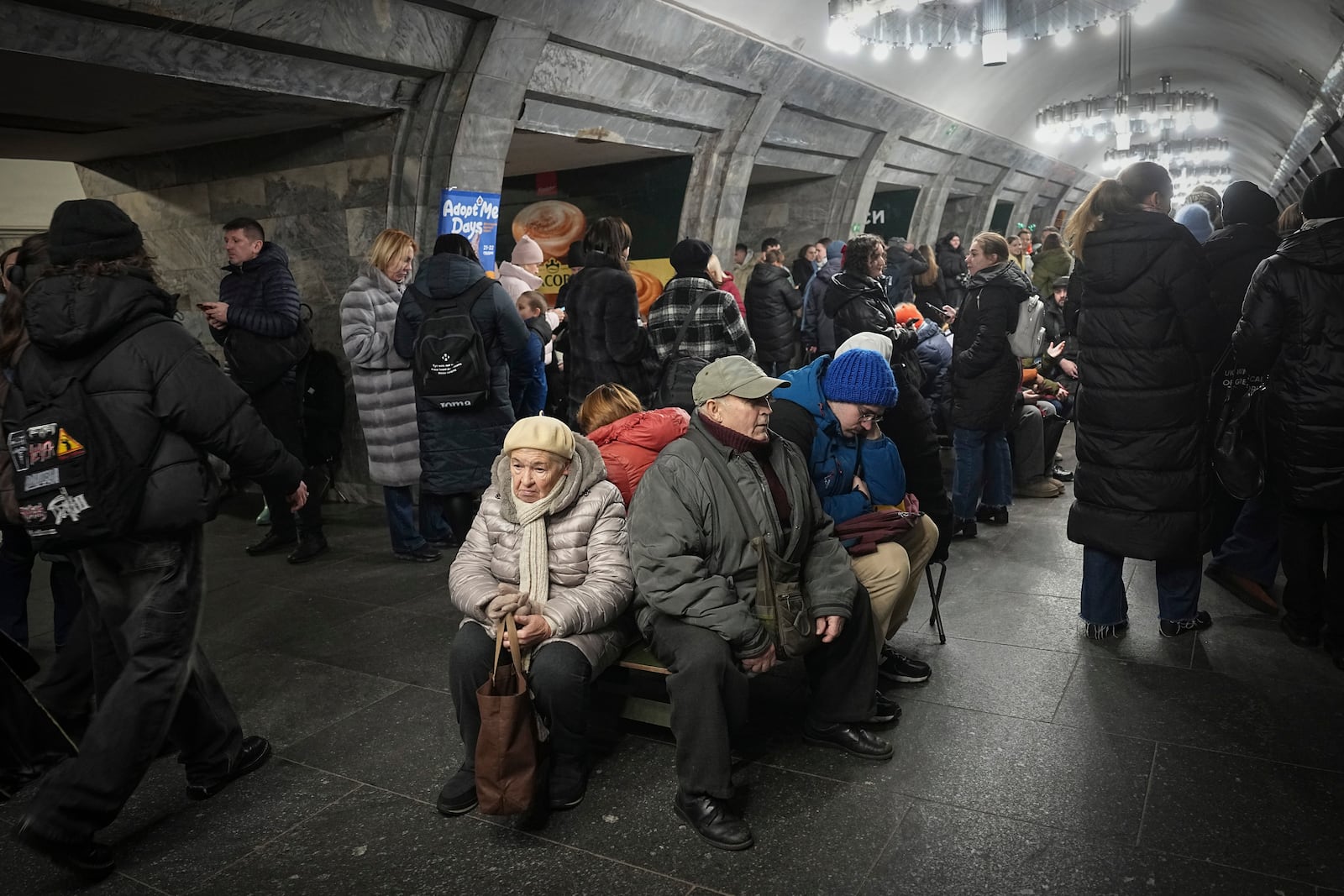 People take shelter in a metro station during an air raid alarm in Kyiv, Ukraine, Friday, Dec. 20, 2024. (AP Photo/Efrem Lukatsky)