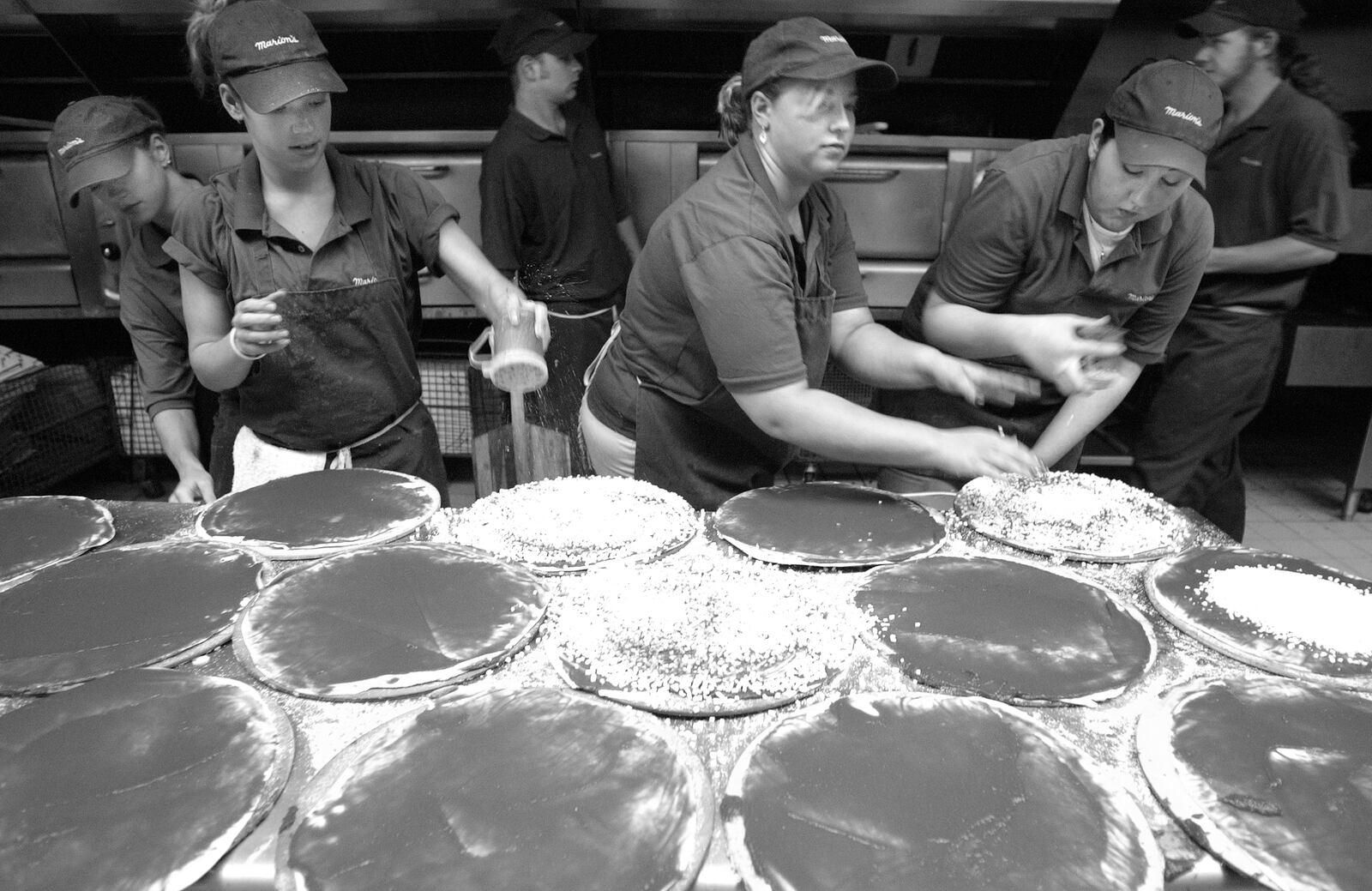  Marion's Piazza marked its 40th anniversary by selling their pizza at 1965 prices.  The line for pizza wrapped around the store at Patterson Road. DAYTON DAILY NEWS ARCHIVE