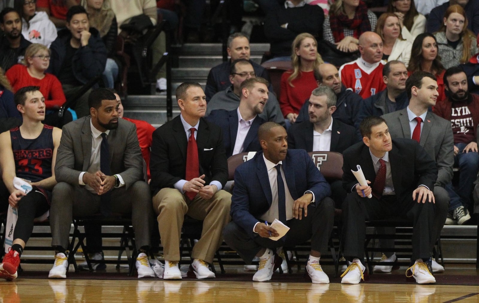 Dayton graduate assistant coach Sean Damaska, back center, talks to fellow grad assistant Brett Comer during a game at Fordham on Jan. 26, 2019, at Rose Hill Gym in Bronx, N.Y. David Jablonski/Staff