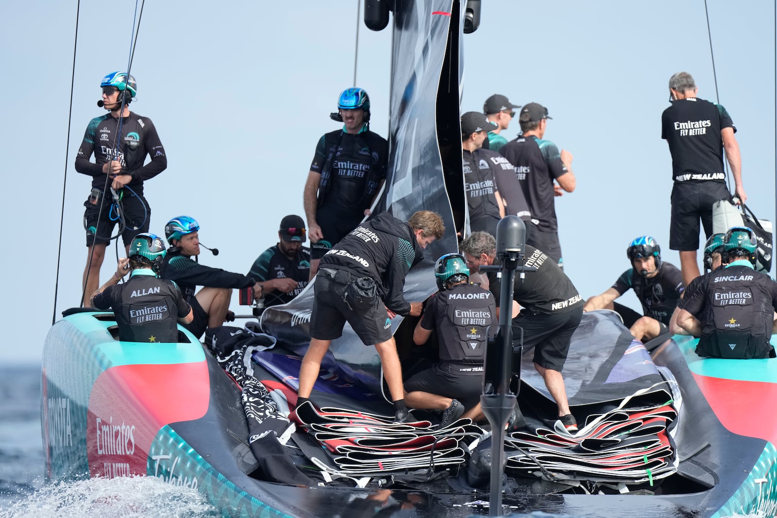 Emirates Team New Zealand crew prepares for the race during the Louis Vuitton 37th America's Cup Day 2 race in Barcelona, Spain, Sunday, Oct. 13, 2024. (AP Photo/Bernat Armangue)