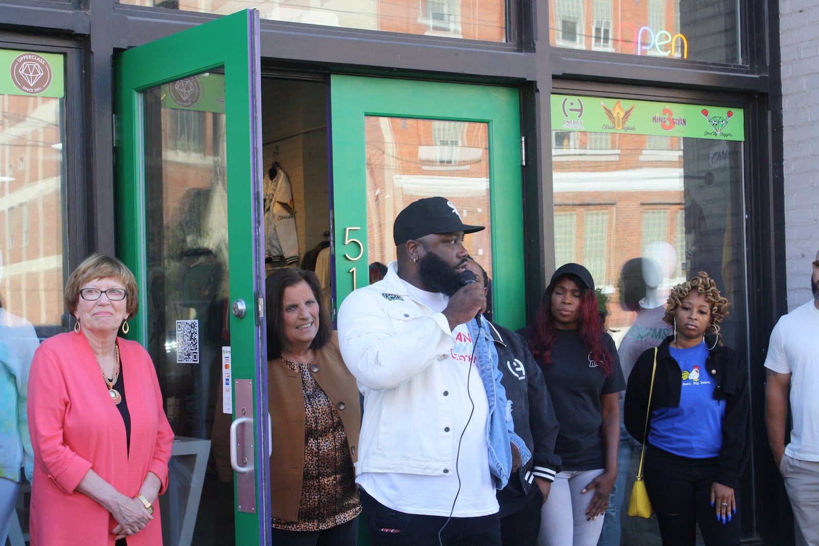 Gems Boutique co-owner Christien Armstrong speaks at the shop's ribbon cutting ceremony Oct. 1, 2021. KAITLIN SCHROEDER