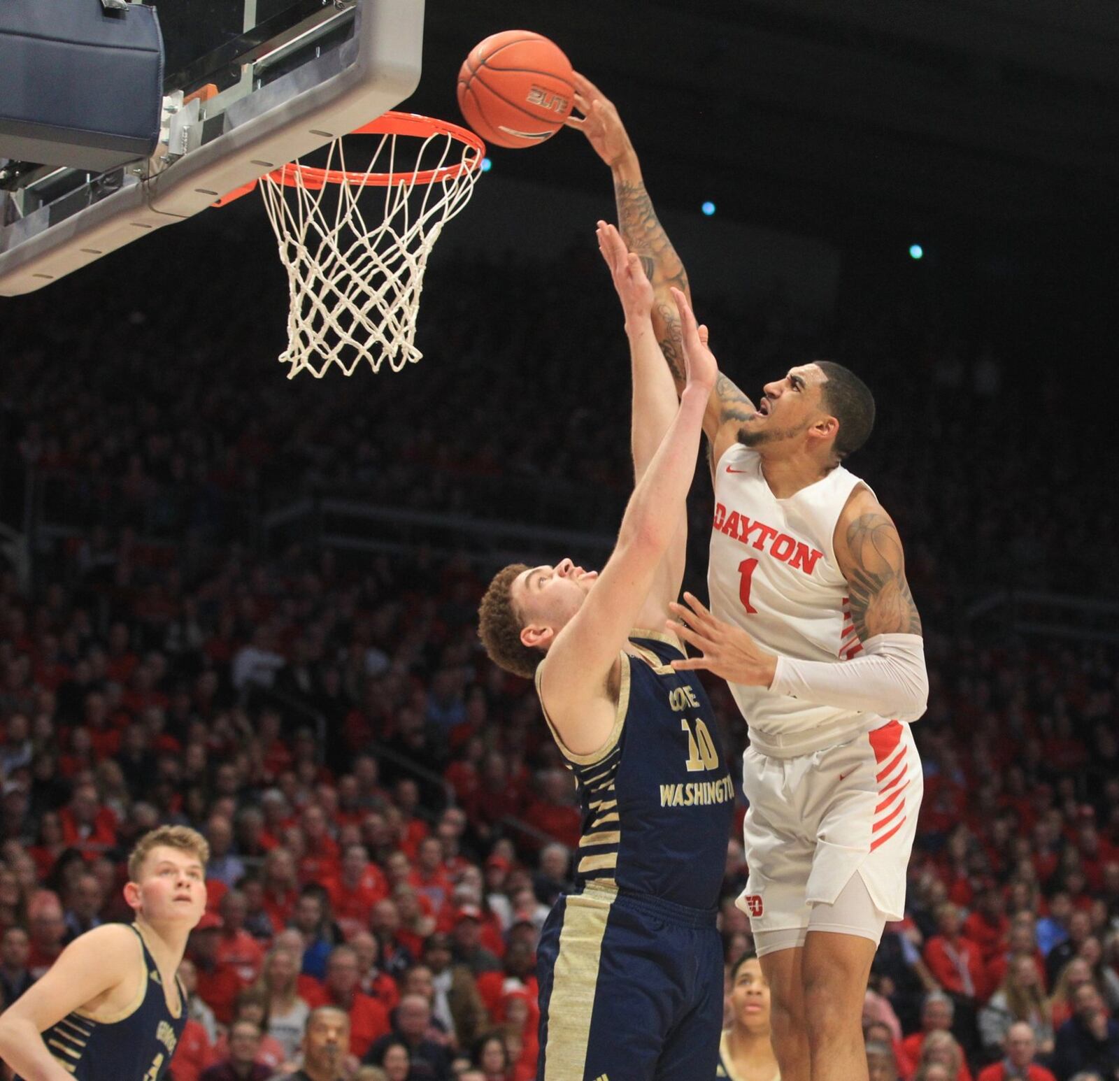 Dayton’s Obi Toppin dunks against George Washington on Saturday, March 7, 2020, at UD Arena. David Jablonski/Staff