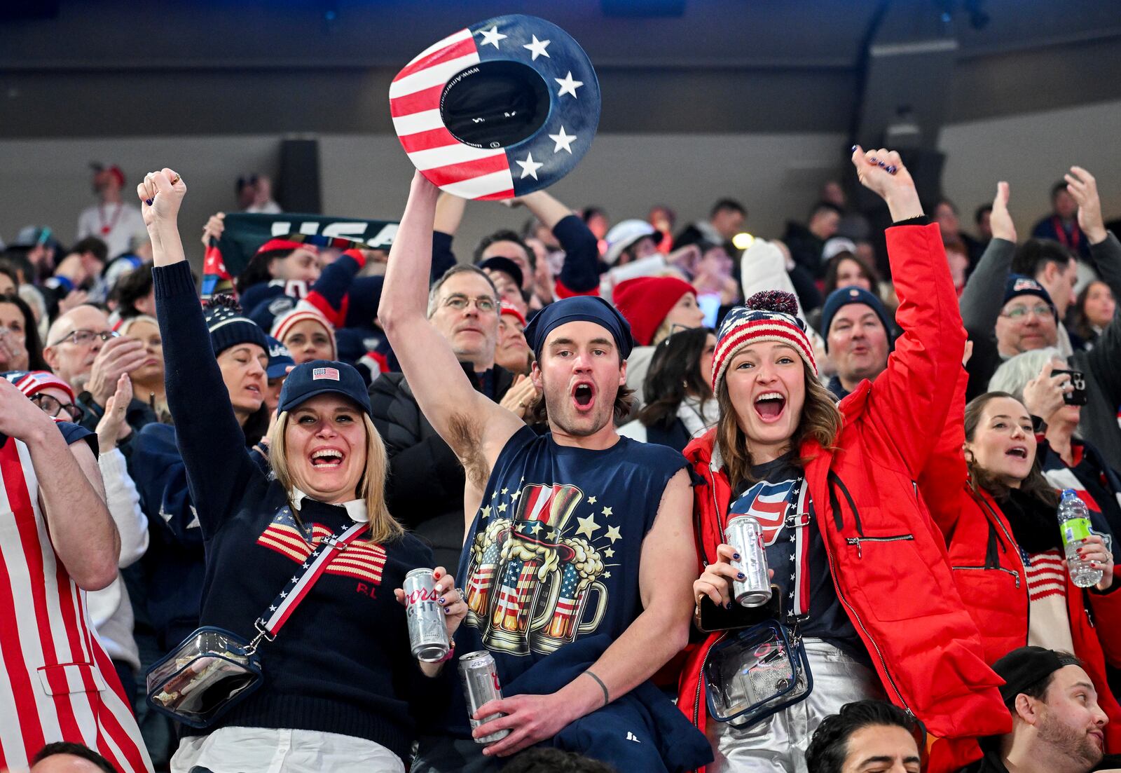 Team United States fans cheer after their team defeated Canada in a 4 Nations Face-Off hockey game in Montreal, Saturday, Feb. 15, 2025. (Graham Hughes/The Canadian Press via AP)