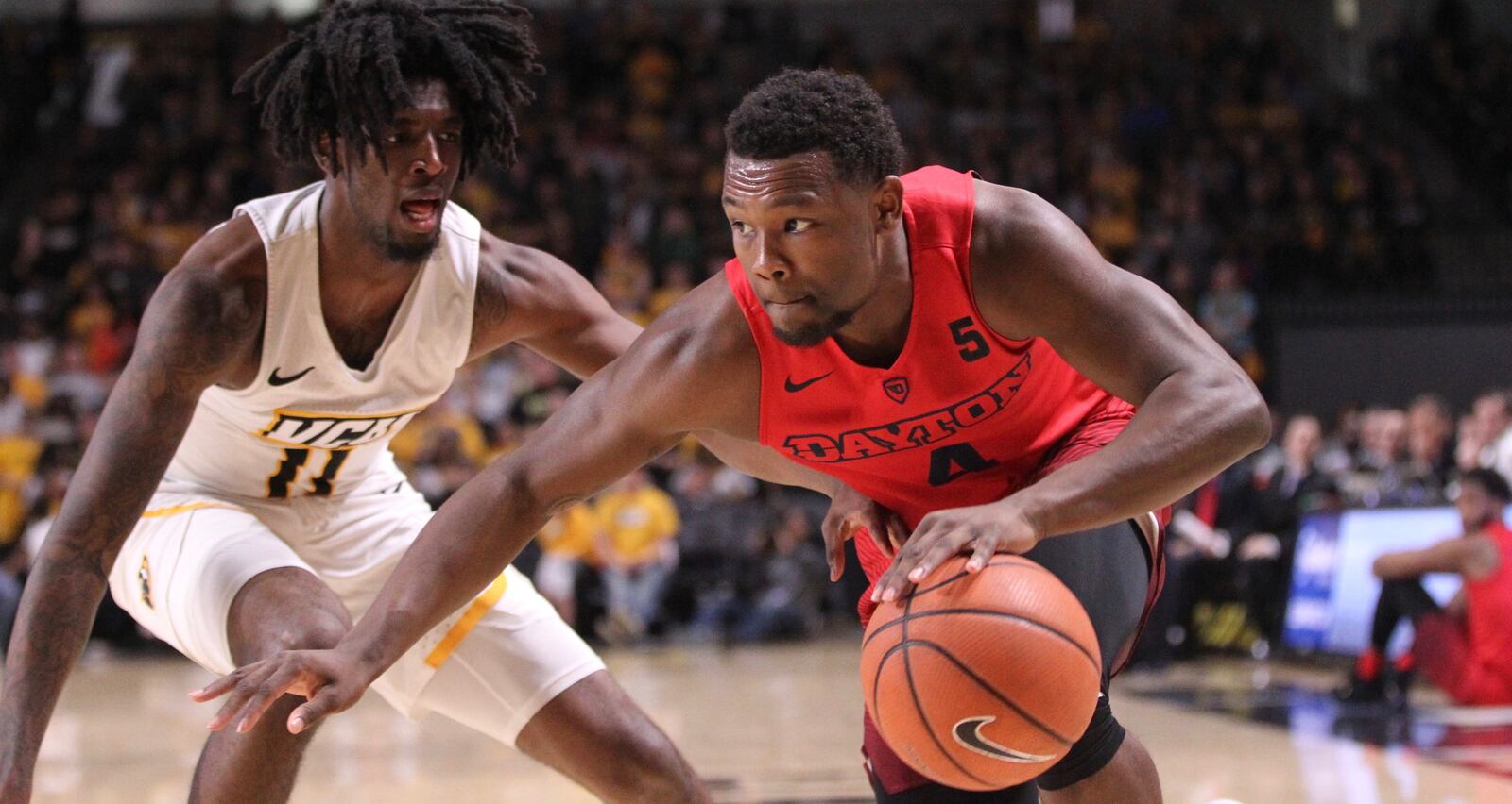 Dayton's Jordan Davis drives to the basket against Virginia Commonwealth's Isaac Vann on Saturday, Feb. 10, 2018, at the Siegel Center in Richmond, Va.