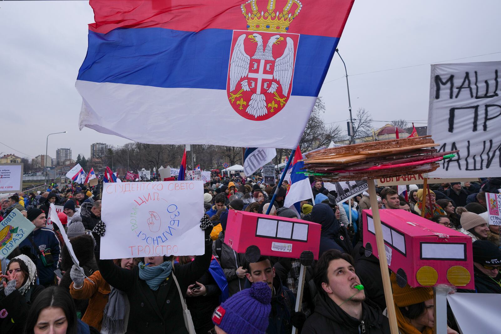 People shout slogans during a student-led large protest and a 15-hour blockade of the streets in Serbian industrial town of Kragujevac, to protest the deaths of 15 people killed in the November collapse of a train station canopy, Saturday, Feb. 15, 2025. (AP Photo/Darko Vojinovic)