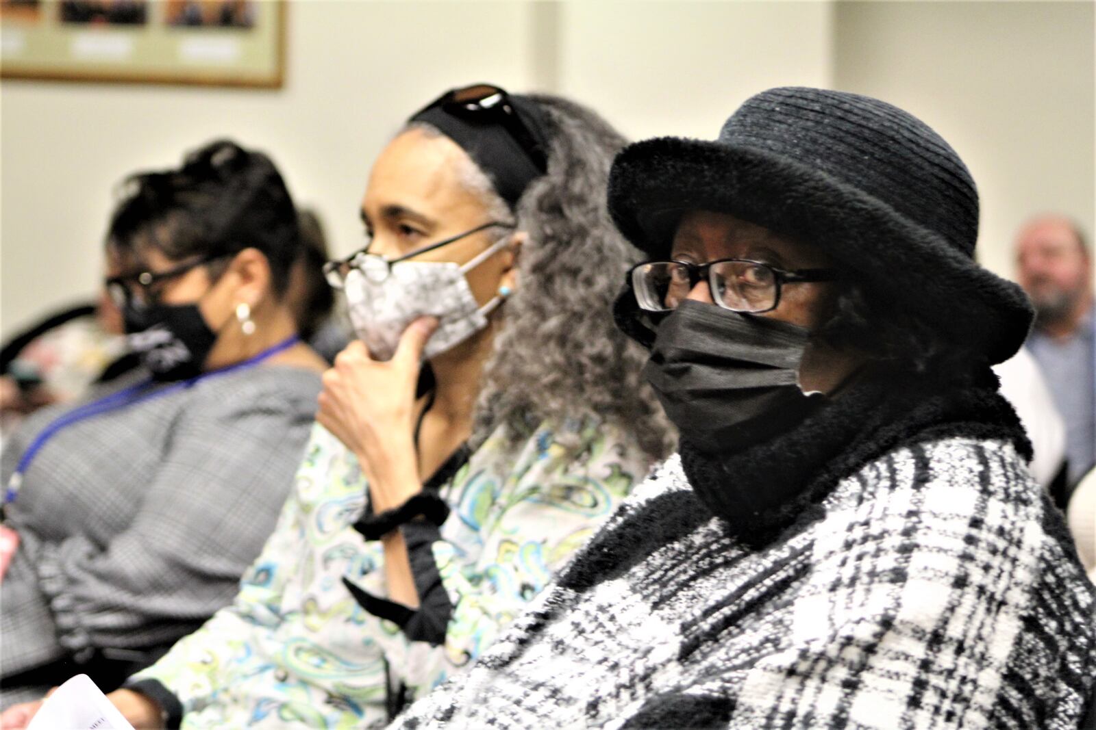 Some visitors and Dayton employees wore face masks at Wednesday's city commission meeting even though the city lifted its indoor mask requirement on Monday. CORNELIUS FROLIK / STAFF