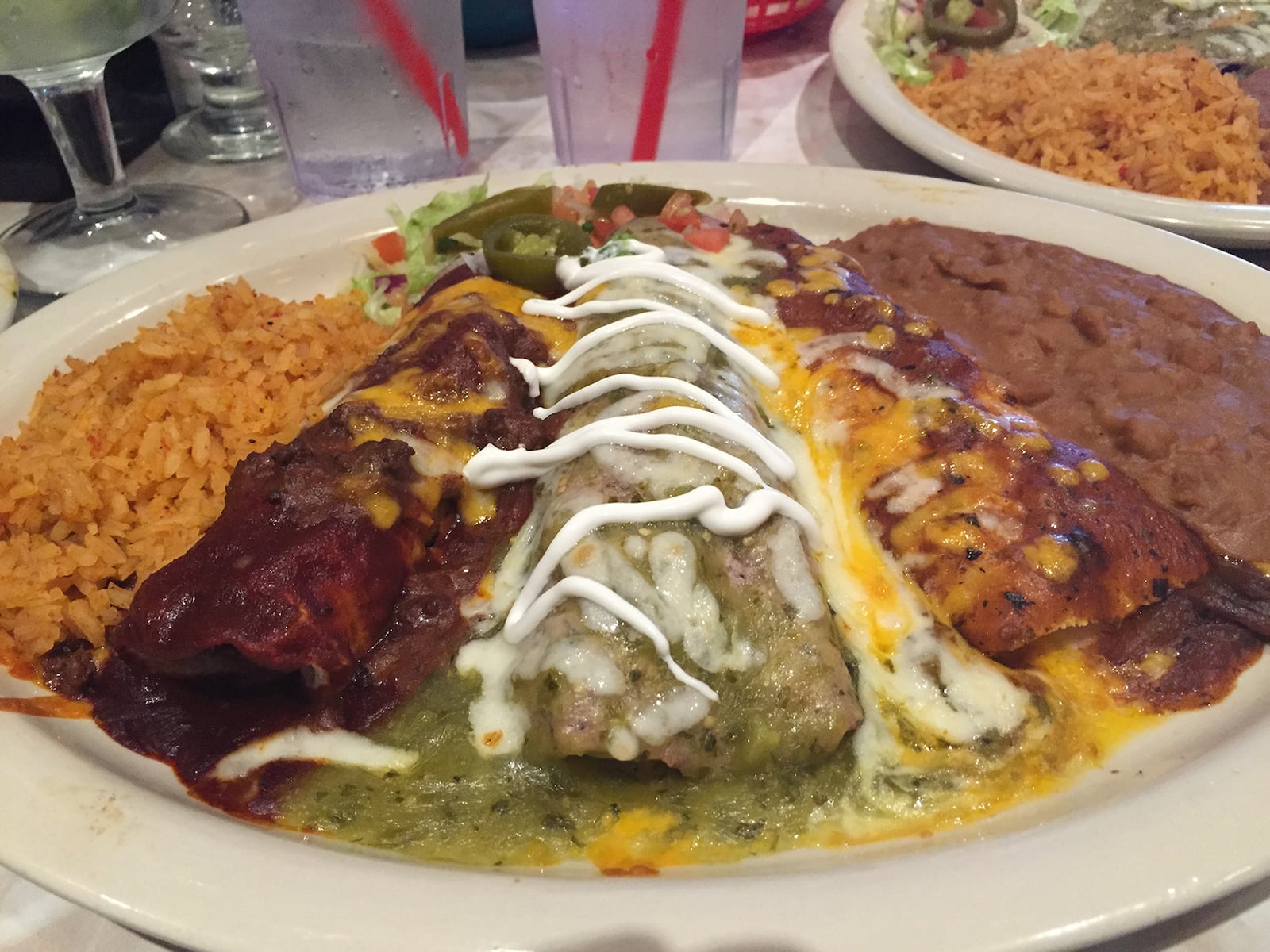 The Elvis Presley Memorial Combo from Chuy's Austin Landing location — a beef Tex-Mex enchilada, cheese Ranchero enchilada, chicken Tomatillo enchilada, seasoned ground sirloin crispy taco and homemade tostada chips dipped in chile con queso. CONTRIBUTED PHOTO BY ALEXIS LARSEN