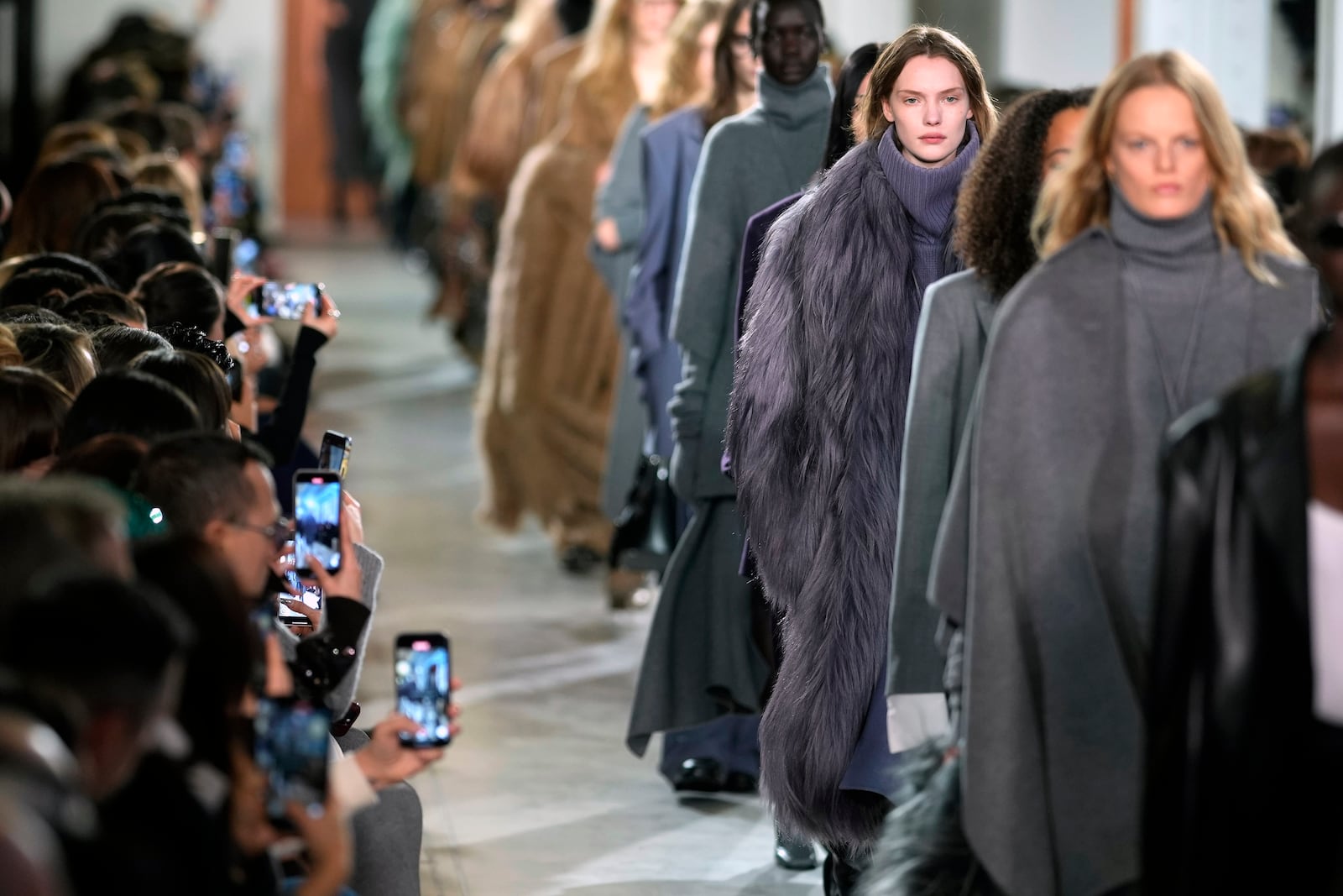 Models walk the runway during the Michael Kors Fall/Winter 2025 fashion show as part of New York Fashion Week on Tuesday, Feb. 11, 2025, at Terminal Warehouse in New York. (Photo by Charles Sykes/Invision/AP)