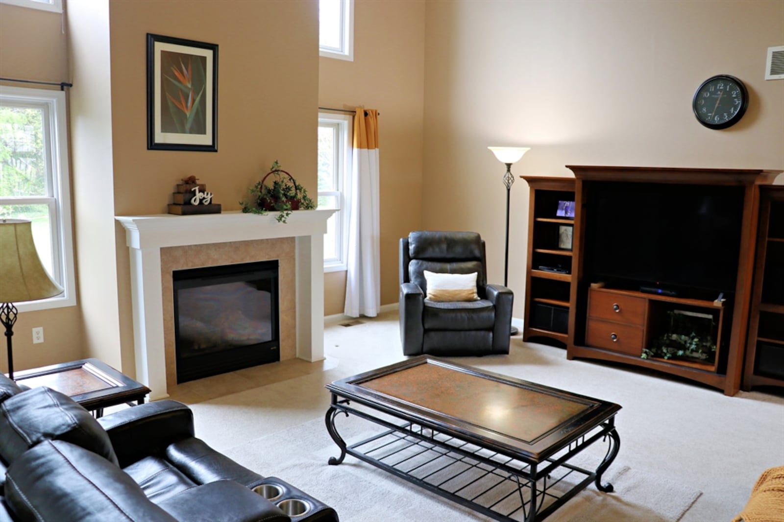 A two-story great room is the centerpiece as the flexible living space flows from the great room to the upper and lower levels.