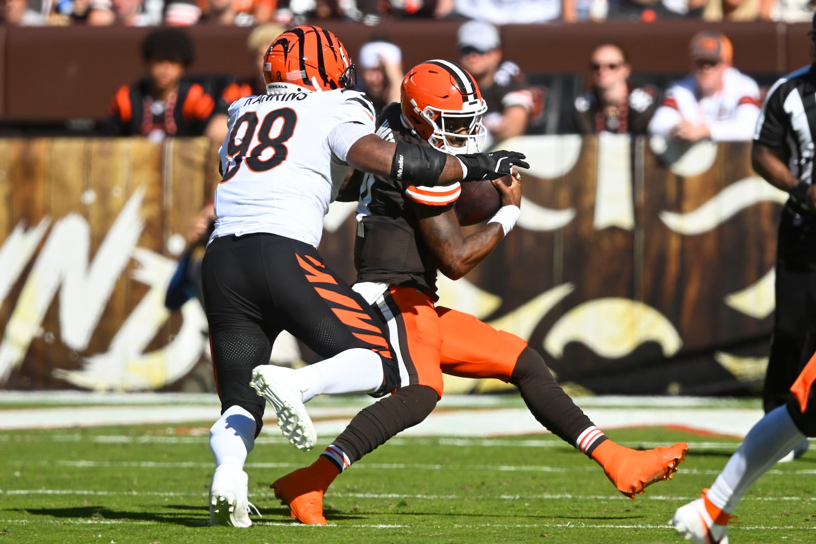 Cleveland Browns quarterback Deshaun Watson is sacked by Cincinnati Bengals defensive tackle Sheldon Rankins (98) in the first half of an NFL football game, Sunday, Oct. 20, 2024, in Cleveland. (AP Photo/David Richard)