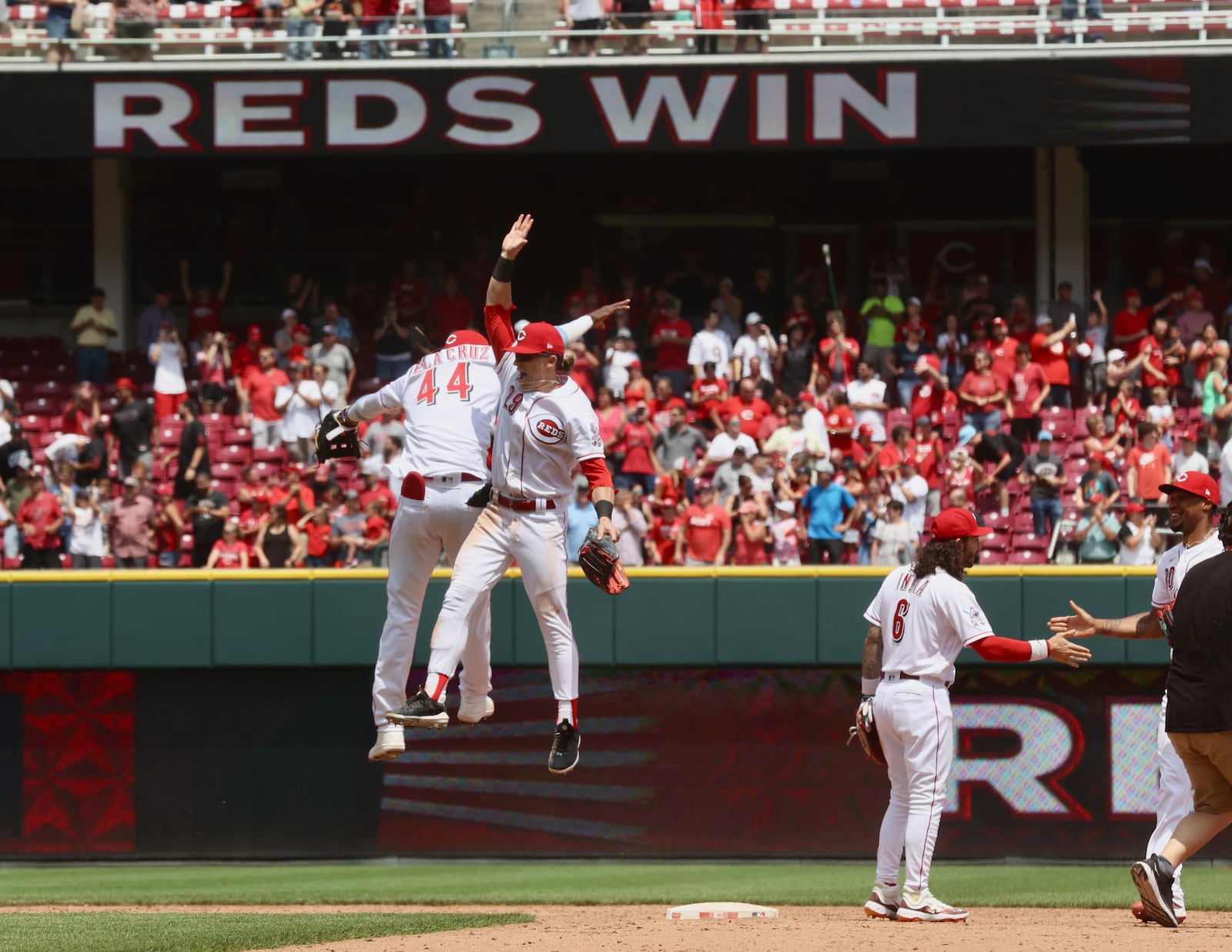 The Reds' Elly De La Cruz, left, and TJ Friedl, celebrate a victory against the Colorado Rockies on Wednesday, June 21, 2023, at Great American Ball Park in Cincinnati. David Jablonski/Staff