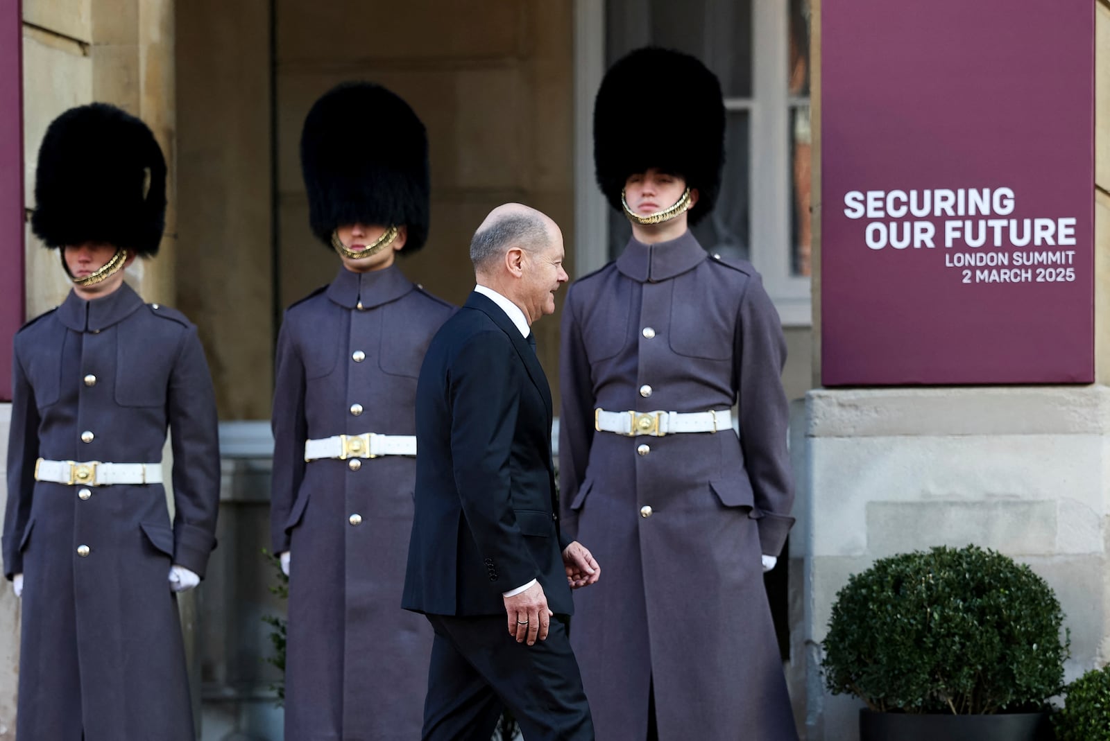 German Chancellor Olaf Scholz arrives for the European leaders' summit to discuss Ukraine, hosted by Britain's Prime Minister Keir Starmer, at Lancaster House, London, Sunday March 2, 2025. (Toby Melville/Pool via AP)