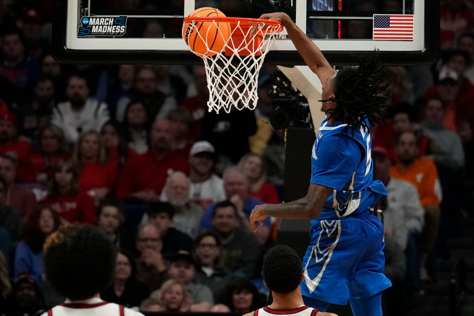 Creighton guard Jamiya Neal (5) dunks against Louisville during the second half in the first round of the NCAA college basketball tournament, Thursday, March 20, 2025, in Lexington, Ky. (AP Photo/Brynn Anderson)