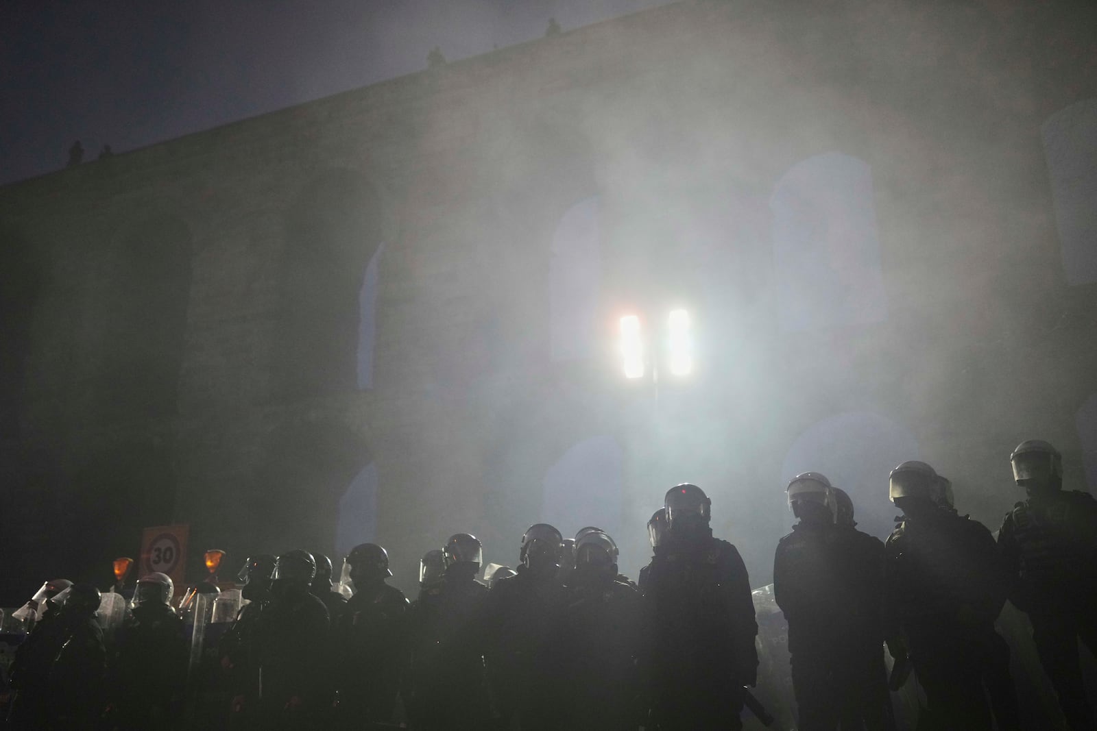 Riot police officers stand guard during a protest after Istanbul's Mayor Ekrem Imamoglu was arrested and sent to prison, in Istanbul, Turkey, Sunday, March 23, 2025. (AP Photo/Francisco Seco)