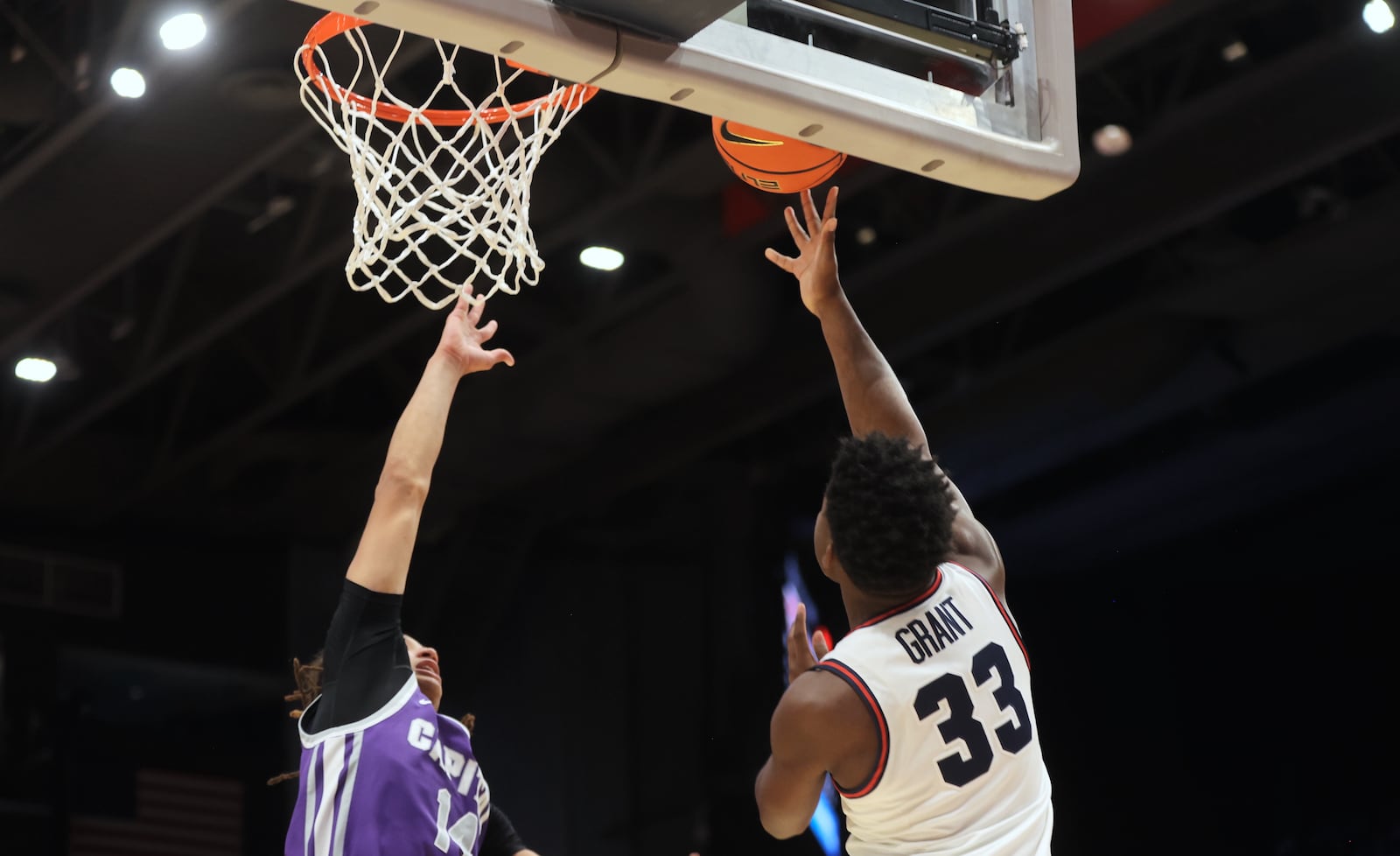 Dayton's Makai Grant scores against Capital on Saturday, Nov. 16, 2024, at UD Arena. David Jablonski/Staff