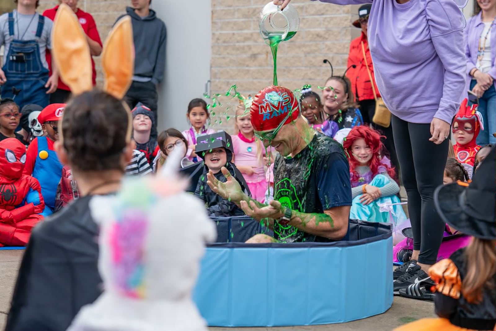 Miami Valley School Head of School David Long gets "slimed" by early childhood school students as a reward for winning a schoolwide contest.