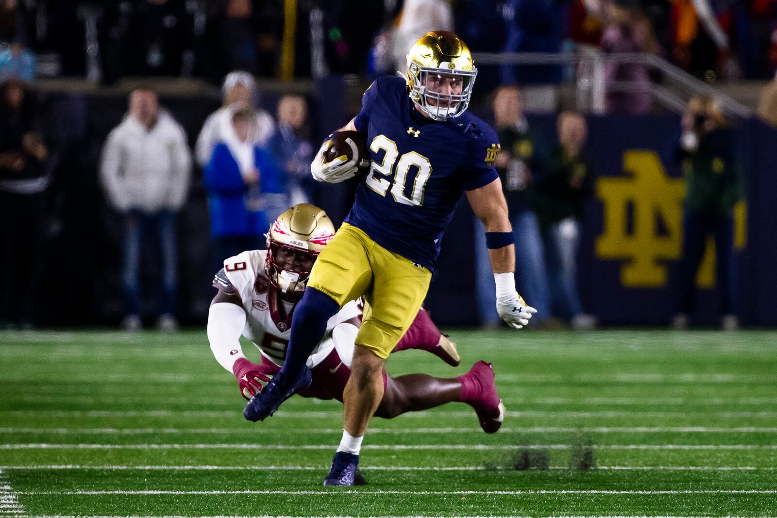 Notre Dame running back Aneyas Williams (20) gets past Florida State linebacker Omar Graham Jr. (9) during the first half of an NCAA college football game Saturday, Nov. 9, 2024, in South Bend, Ind. (AP Photo/Michael Caterina, File)