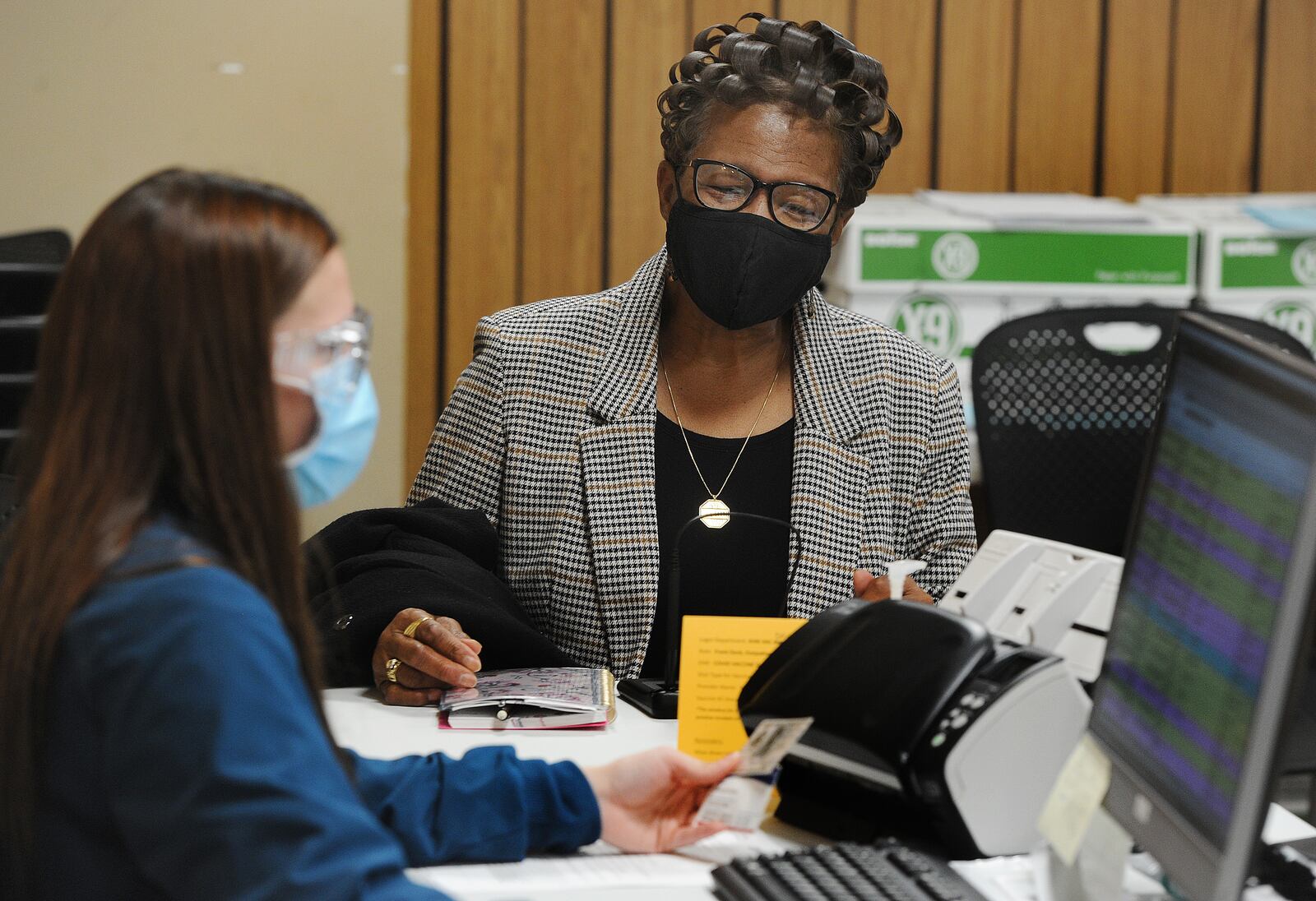 Carol Young prepares to get the COVID-19 vaccine, Thursday, Jan. 28, 2021 at the Grace United Methodist Church. The Kettering Health Network held the vaccine clinic at the church. MARSHALL GORBY\STAFF