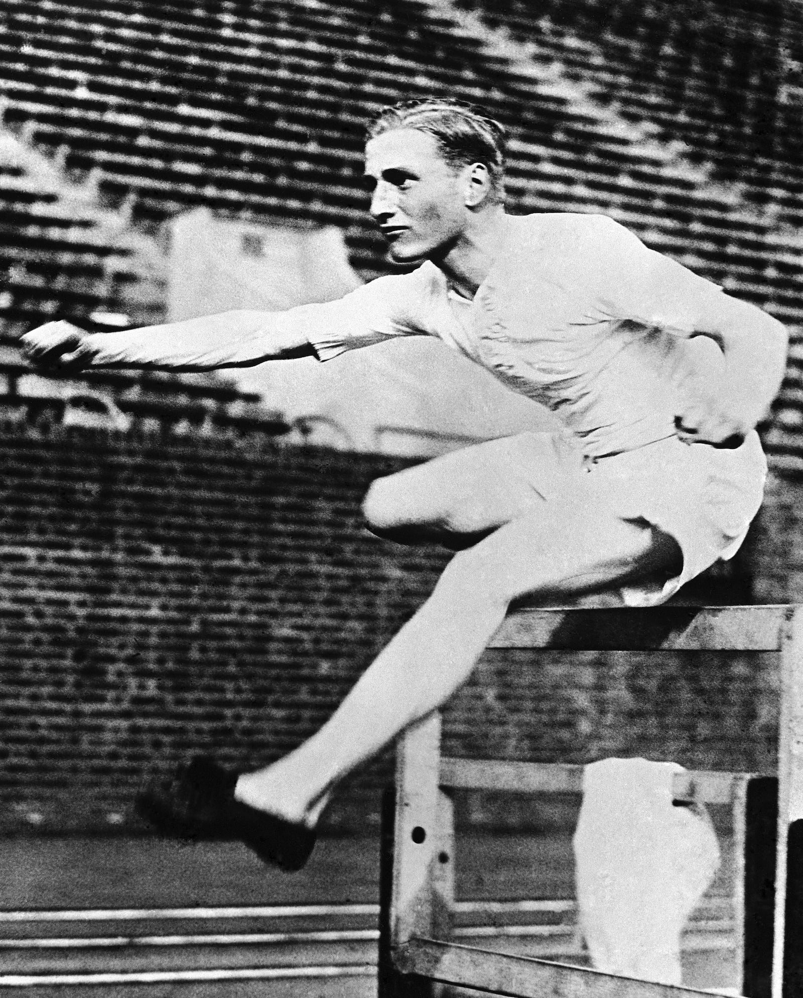 FILE -English athlete Lord David Burghley during a training session over hurdles at Franklin Field, Philadelphia, PA., in 1926. (AP Photo, File)