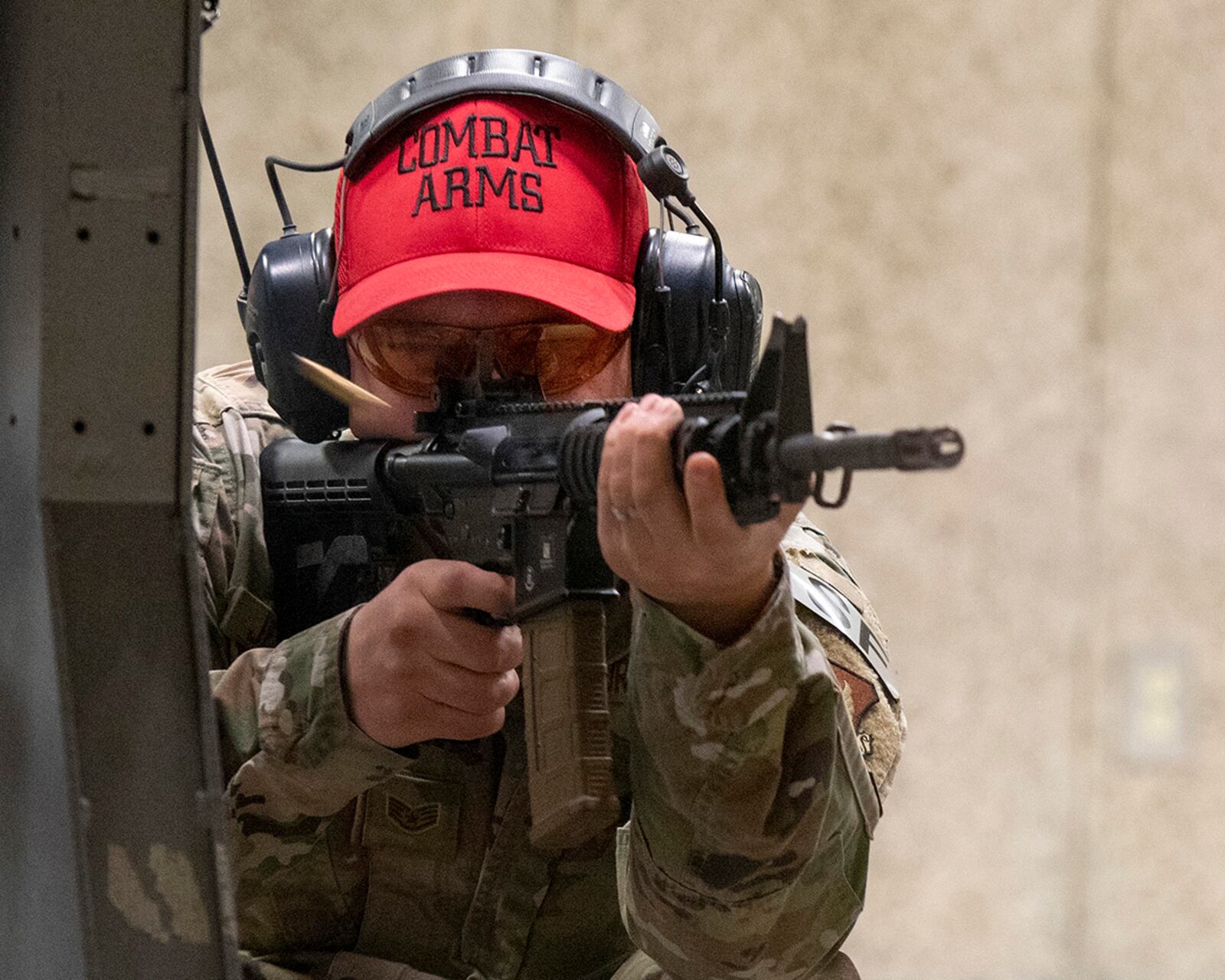 Staff Sgt. Paul Jezowski, 88th Security Forces Squadron combat arms instructor, fires an M4 rifle May 11 at the unit’s indoor shooting range on Wright-Patterson Air Force Base. Jezowski was among participants in the Police Week shooting competition, where SFS members battled for the best score firing both pistol and rifles. U.S. AIR FORCE PHOTO/R.J. ORIEZ