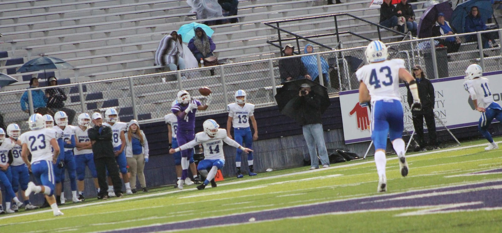 Middletown’s Shandon Morris (4) makes a leaping catch over Springboro’s Jared McCarthy (14) during Friday night’s game at Barnitz Stadium in Middletown. CONTRIBUTED PHOTO BY MARITZA MCKINNEY