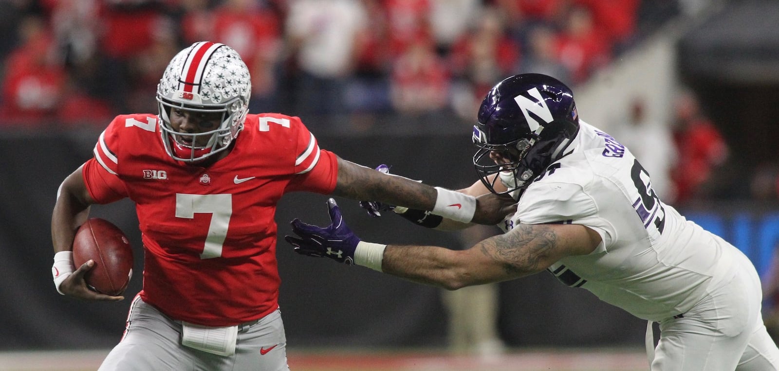 Ohio State’s Dwayne Haskins runs against Northwestern in the Big Ten Championship on Saturday, Dec. 2, 2018, at Lucas Oil Stadium in Indianapolis. David Jablonski/Staff