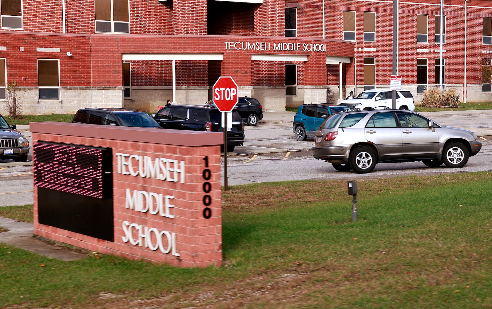 Parents pick up their children at Tecumseh Middle School Tuesday, Nov. 19, 2024. BILL LACKEY/STAFF