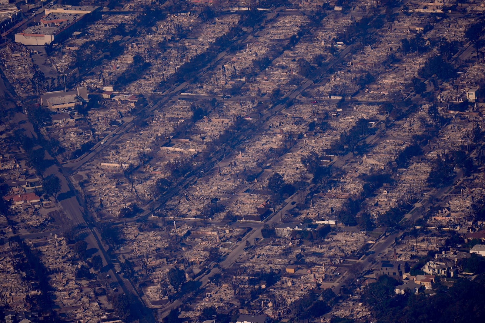 The devastation from the Palisades Fire is seen from the air in the Pacific Palisades neighborhood of Los Angeles, Thursday, Jan. 9, 2025. (AP Photo/Mark J. Terrill)