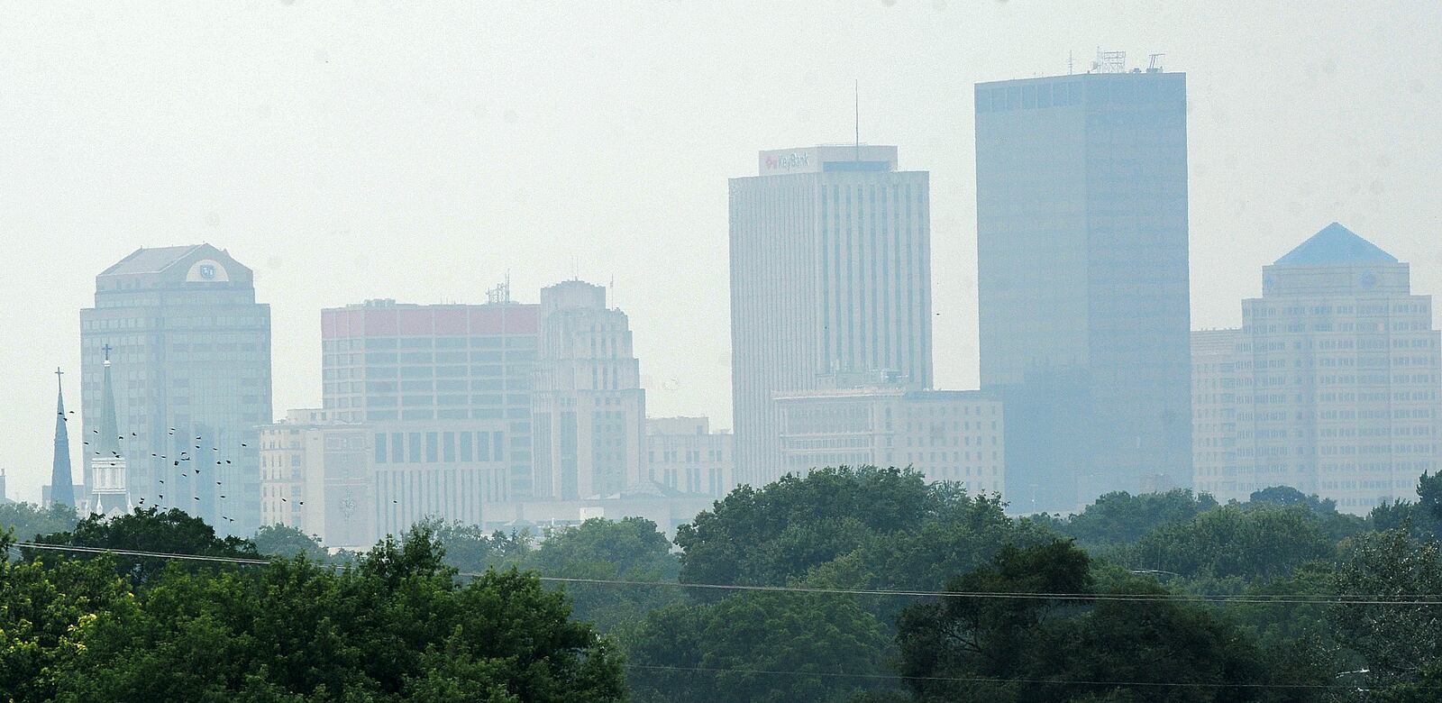 Smoke from forest fires in Canada has once again drifted over the downtown Dayton area, Monday July 17, 2023. MARSHALL GORBY\STAFF