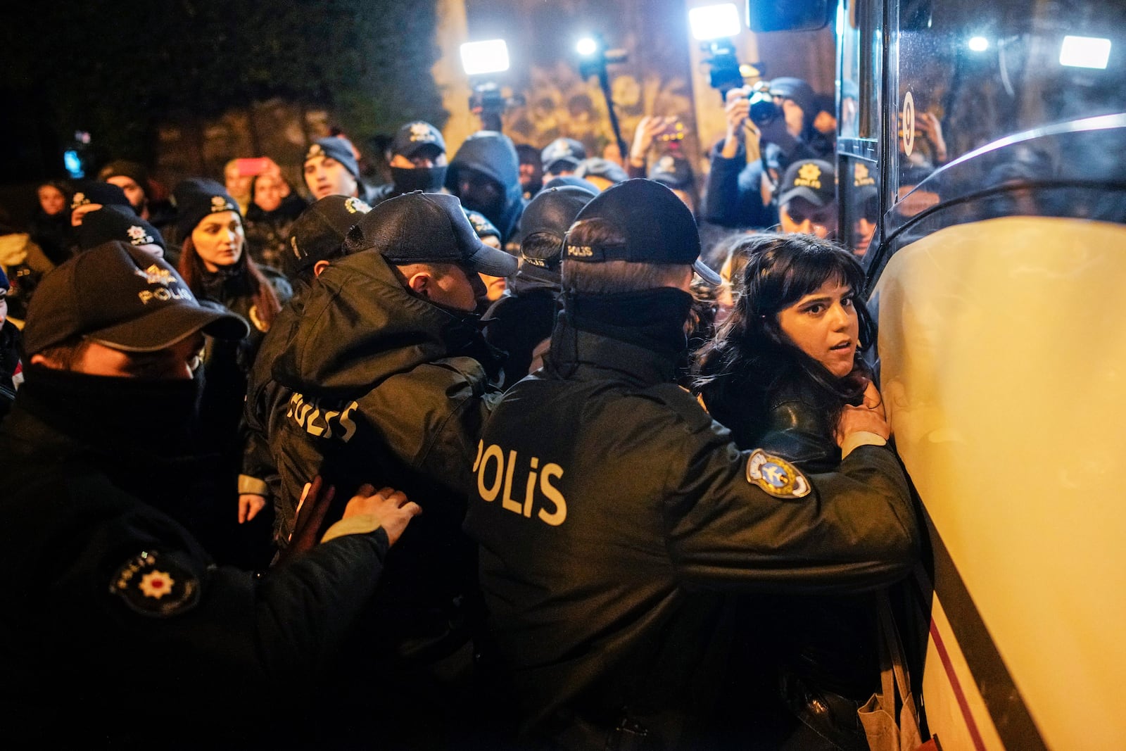 Turkish police officers detain a woman during a protest marking the International Day for the Elimination of Violence Against Women, in Istanbul, Turkey, Monday, Nov. 25, 2024. (AP Photo/Emrah Gurel)