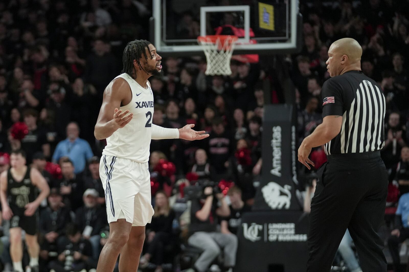 Xavier forward Jerome Hunter, left, argues after a foul call during the second half of an NCAA college basketball game against Cincinnati, Saturday, Dec. 14, 2024, in Cincinnati. (AP Photo/Joshua A. Bickel)