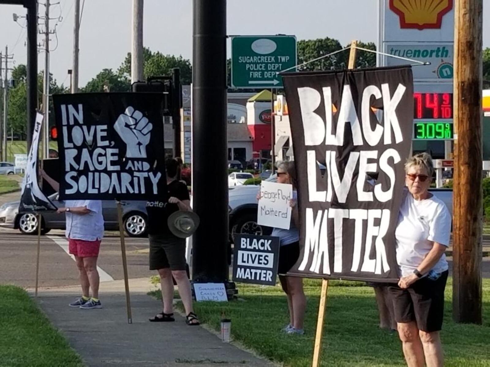 A demonstration in Sugarcreek Twp. at the intersection Wilmington Pike and Clyo Road marks the one-year anniversary of George Floyd's murder in Minneapolis.