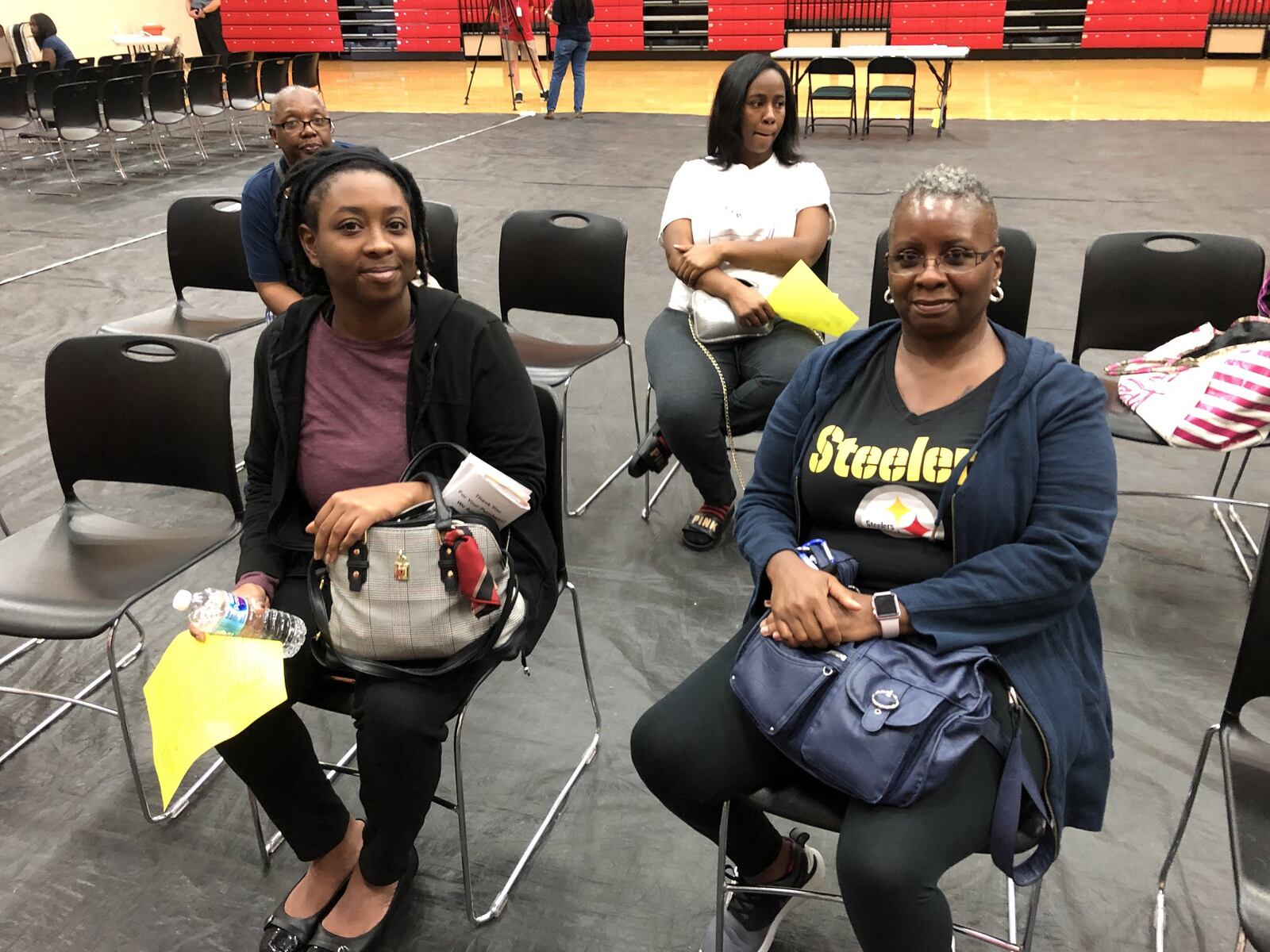 Tornado survivor Natasha Woods, 31, of Trotwood came to apply for help from FEMA at the new Disaster Recovery Center that opened at Trotwood-Madison High School Saturday. She is with her mother, Benita Brown of Trotwood. STAFF PHOTO/Lynn Hulsey