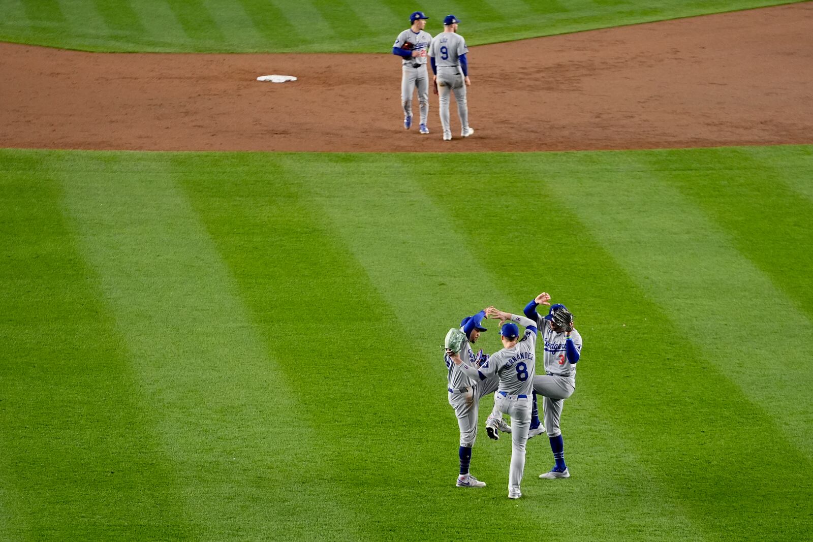 The Los Angeles Dodgers celebrates their win against the New York Yankees in Game 3 of the baseball World Series, Monday, Oct. 28, 2024, in New York. (AP Photo/Frank Franklin II)