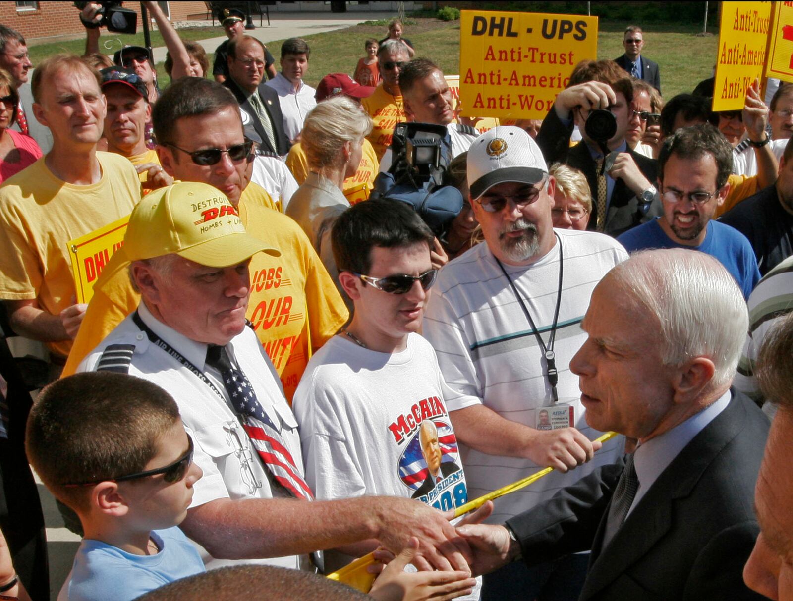 Sen. John McCain greets people on the campus of Wilmington College. McCain made a stop in Wilmington Thursday Aug. 7 to speak in a private meeting with a group of local community leaders trying to save about 8,000 jobs at DHL's Wilmington air freight hub. Staff photo by Lisa Powell