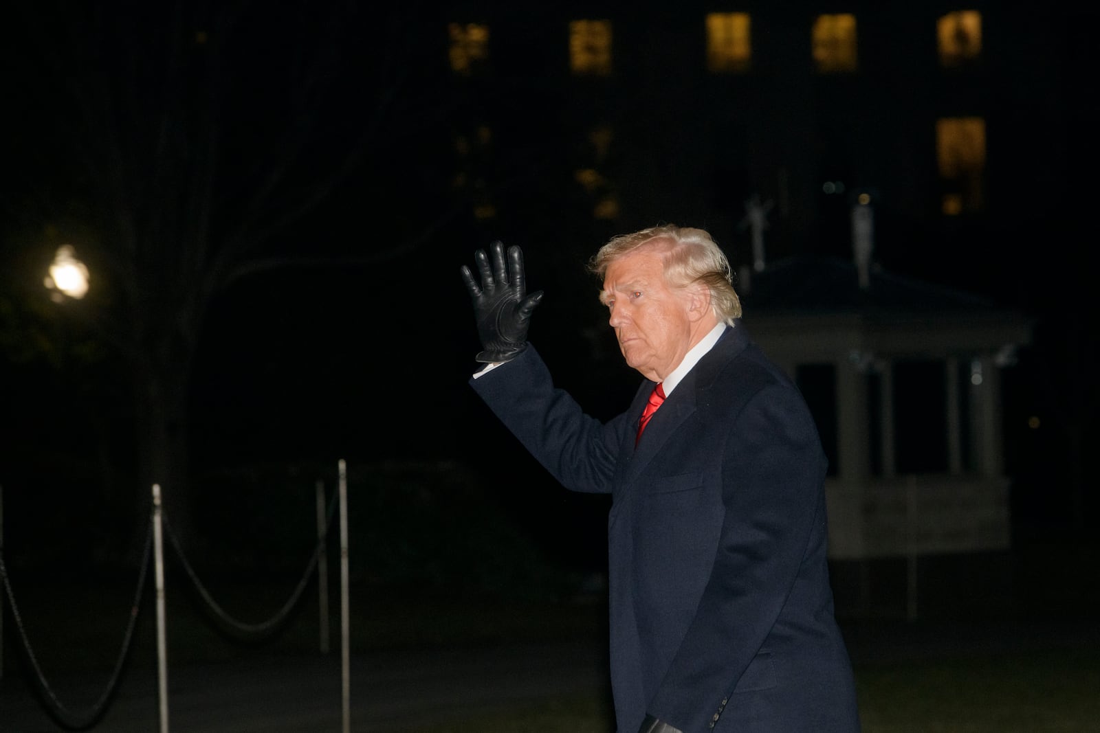 President Donald Trump waves as he walks from Marine One upon arrival on the South Lawn of the White House in Washington, Monday, Jan. 27, 2025. (AP Photo/Rod Lamkey, Jr.)