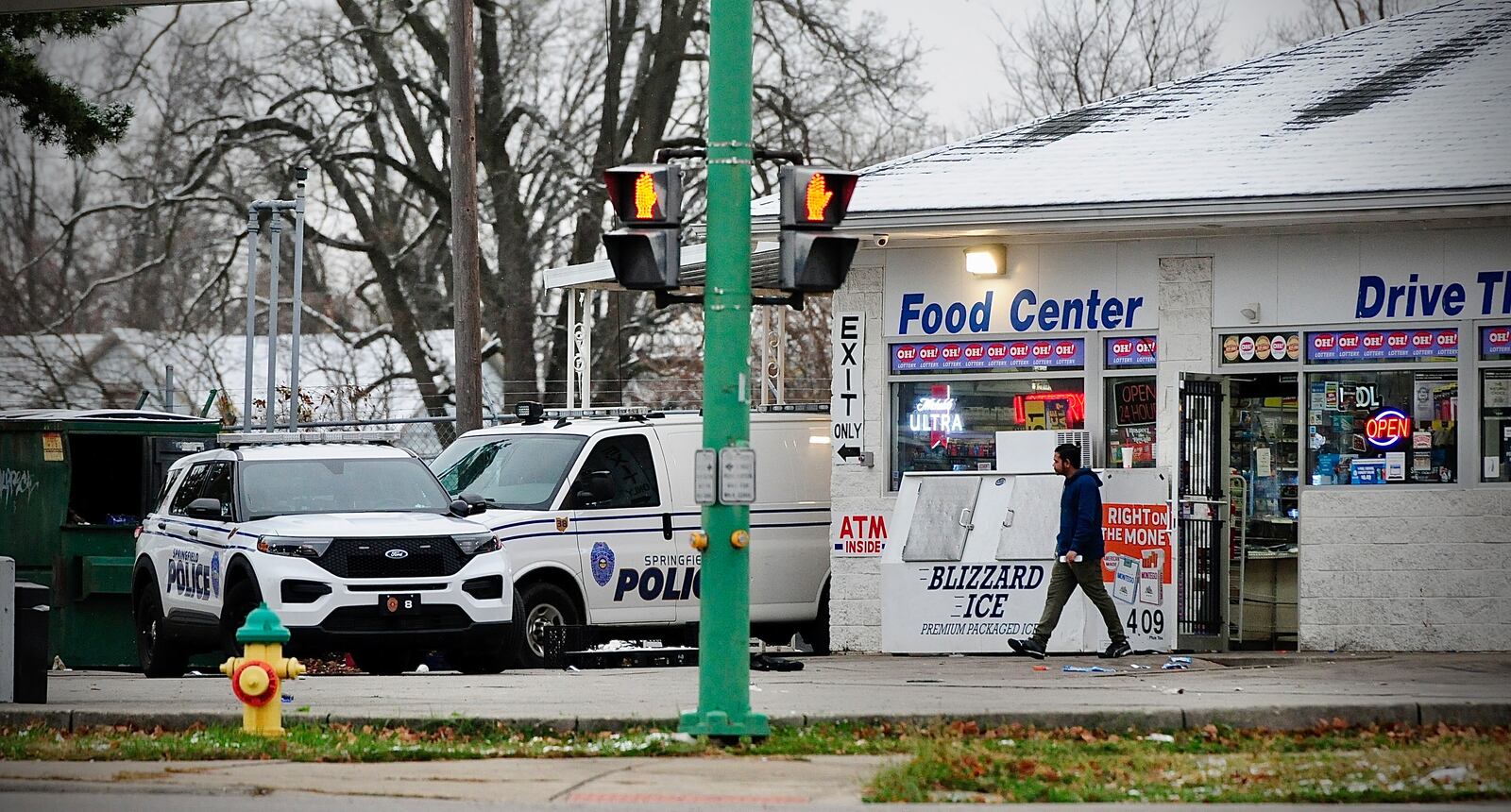 Springfield police on the scene of an officer-involved shooting at a  Sunoco station at the intersection of Selma Road and East Street Sunday morning. MARSHALL GORBY \STAFF