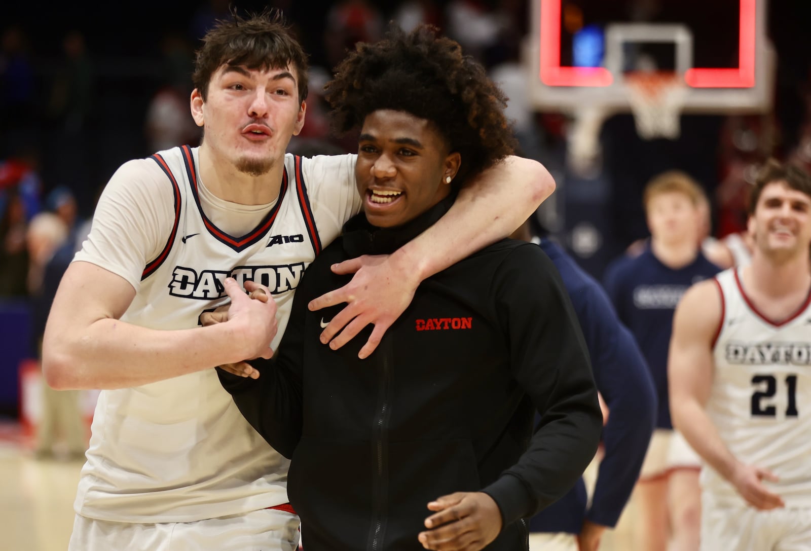 Dayton's Isaac Jack and Marvel Allen leave the court after a victory against Grambling State on Saturday, Dec. 2, 2023, at UD Arena. David Jablonski/Staff