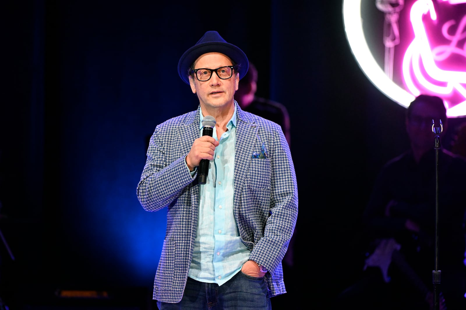 Comedian Rob Schneider performs for the crowd before Independent presidential candidate Robert F. Kennedy Jr. speaks to supporters during a campaign event, Sunday, April 21, 2024, in Royal Oak, Mich. (AP Photo/Jose Juarez)