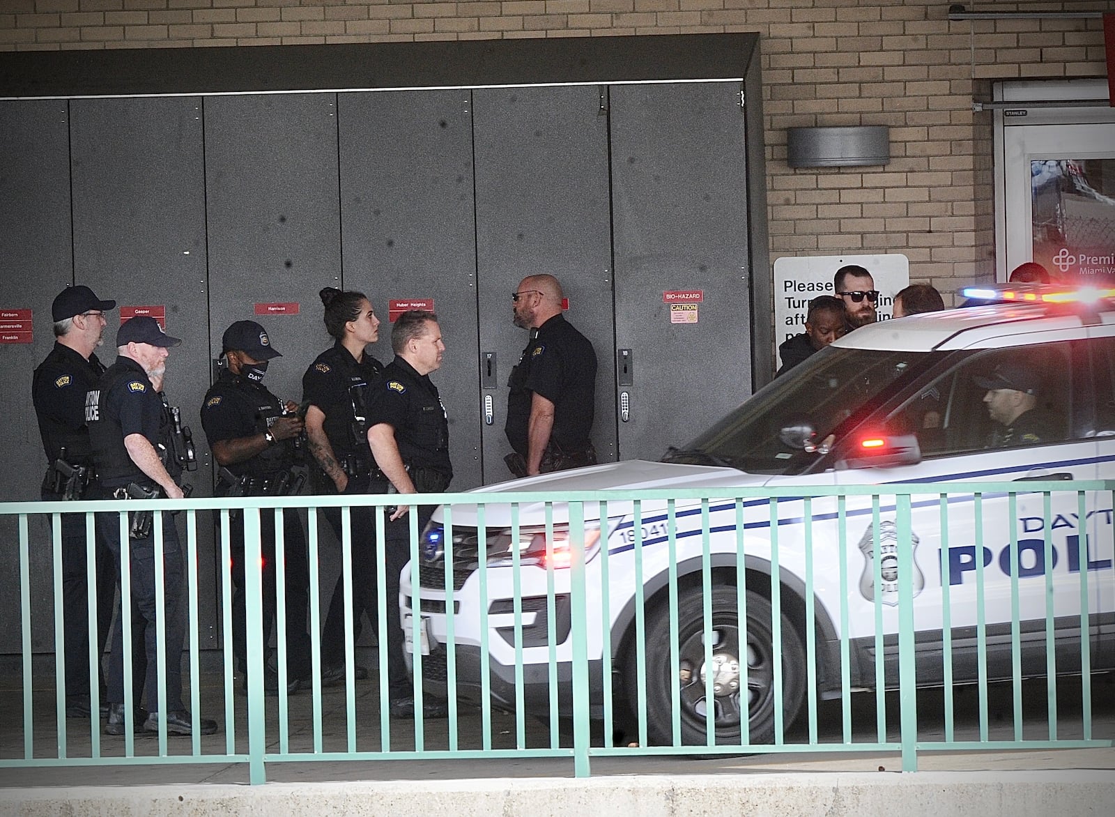 Dayton officers gathered in a show of support outside Miami Valley Hospital Thursday, Oct. 13, 2022, after an officer was stabbed during a call on Bancroft Avenue. MARSHALL GORBY \STAFF