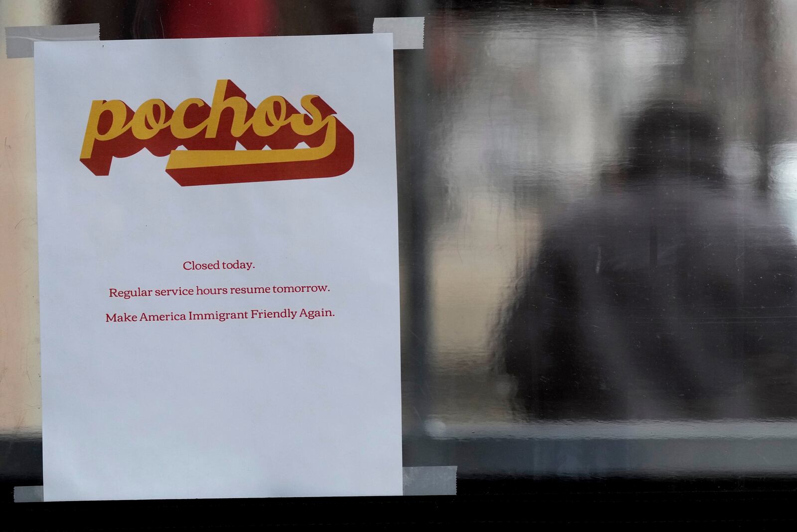 A closed sign in displayed at a restaurant in the Pilsen neighborhood of Chicago, closes to stand with immigrants in Chicago, Monday, Feb. 3, 2025. (AP Photo/Nam Y. Huh)