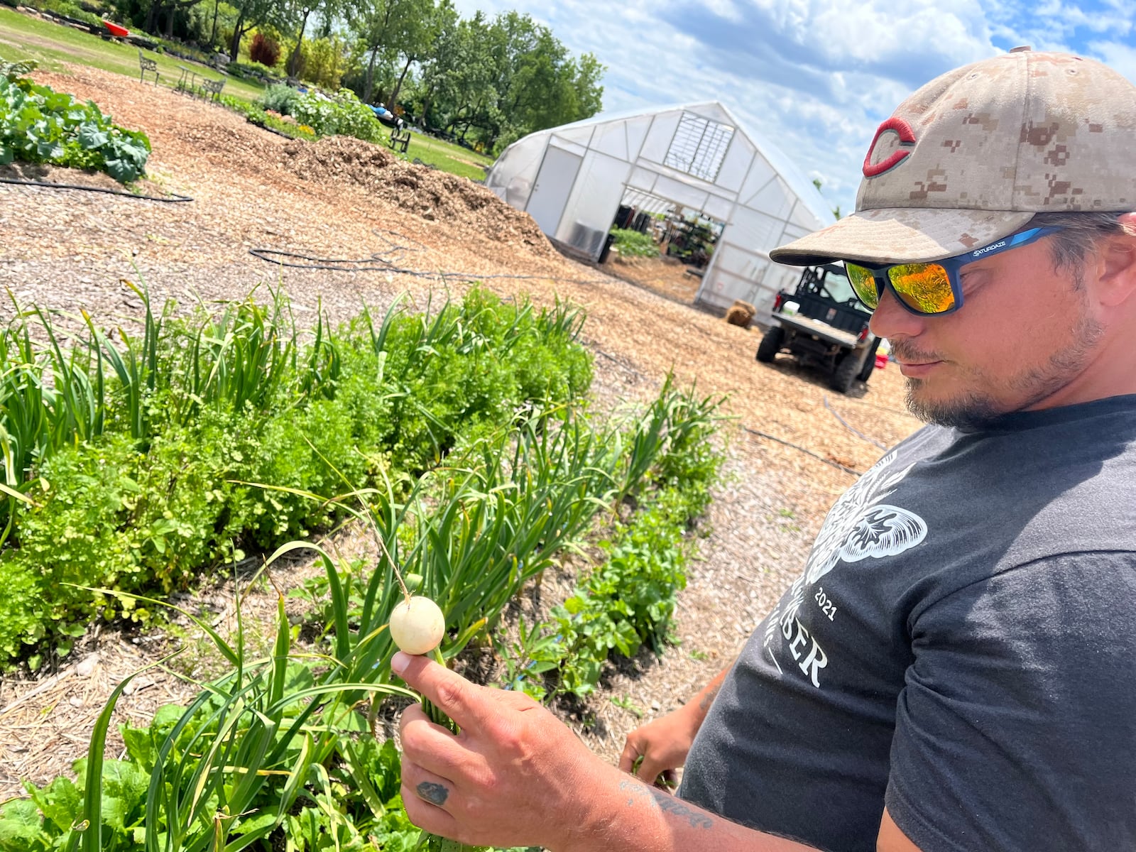 Oak & Ember Farms is a 36-acre regenerative farm with 10-acres of forest and a 5-acre lake at 2645 Olt Road, just outside of Dayton in Jefferson Twp. Pictured is Managing Partner Chris Harrison. NATALIE JONES/STAFF