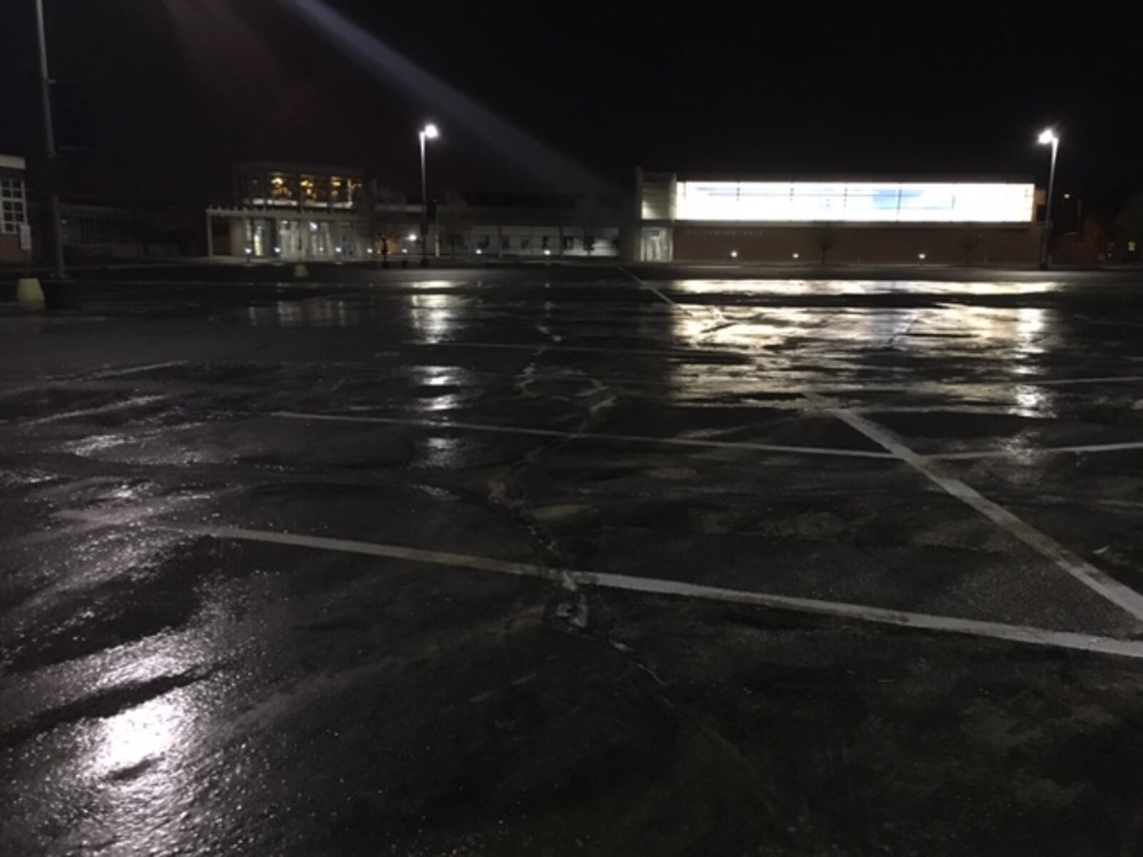 A fire hydrant line ruptured and the Kettering Fairmont High School parking lot is covered in patches of ice, Dec. 8, 2017. JOEY BRYANT/STAFF